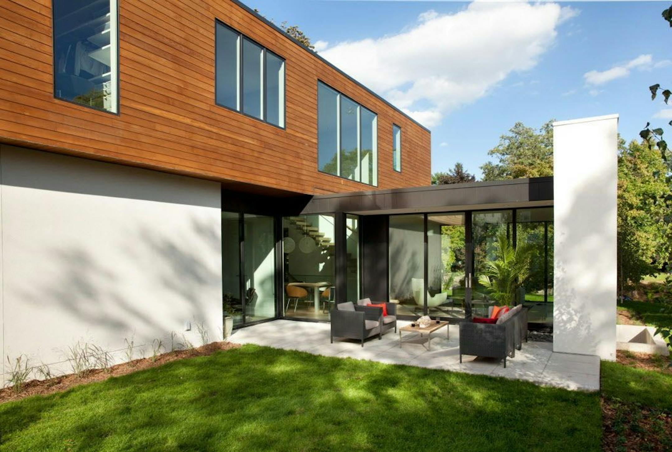 The living room opens to a private backyard retreat.