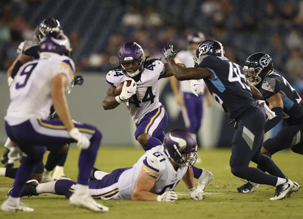 Minnesota Vikings running back Mike Boone (44) gains 46 yards on a fourth-quarter run against the Tennessee Titans in a preseason game on Thursday, Au
