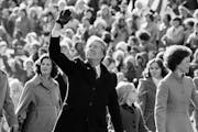 FILE - In this Thursday, Jan. 20, 1977 file photo, President Jimmy Carter waves to the crowd while walking with his wife, Rosalynn, and their daughter