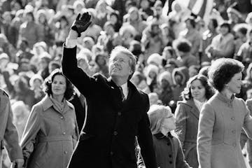 FILE - In this Thursday, Jan. 20, 1977 file photo, President Jimmy Carter waves to the crowd while walking with his wife, Rosalynn, and their daughter