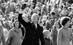 FILE - In this Thursday, Jan. 20, 1977 file photo, President Jimmy Carter waves to the crowd while walking with his wife, Rosalynn, and their daughter