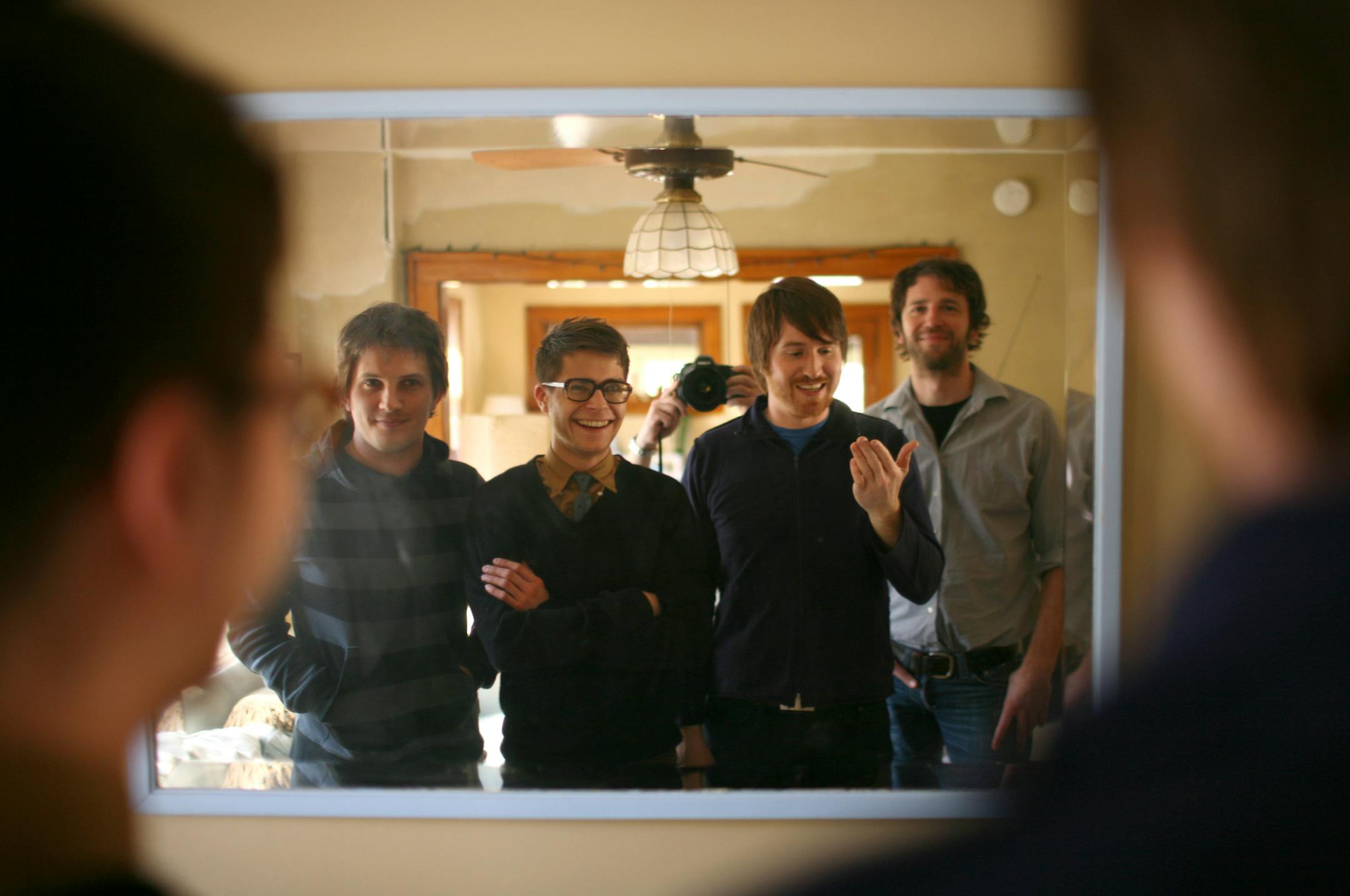 Tapes 'N Tapes are, from left, keyboardist Matt Kretzmann, drummer Jeremy Hanson, singer/guitarist Josh Grier, and bassist Erik Appelwick. They're in Matt Kretzmann's living room.