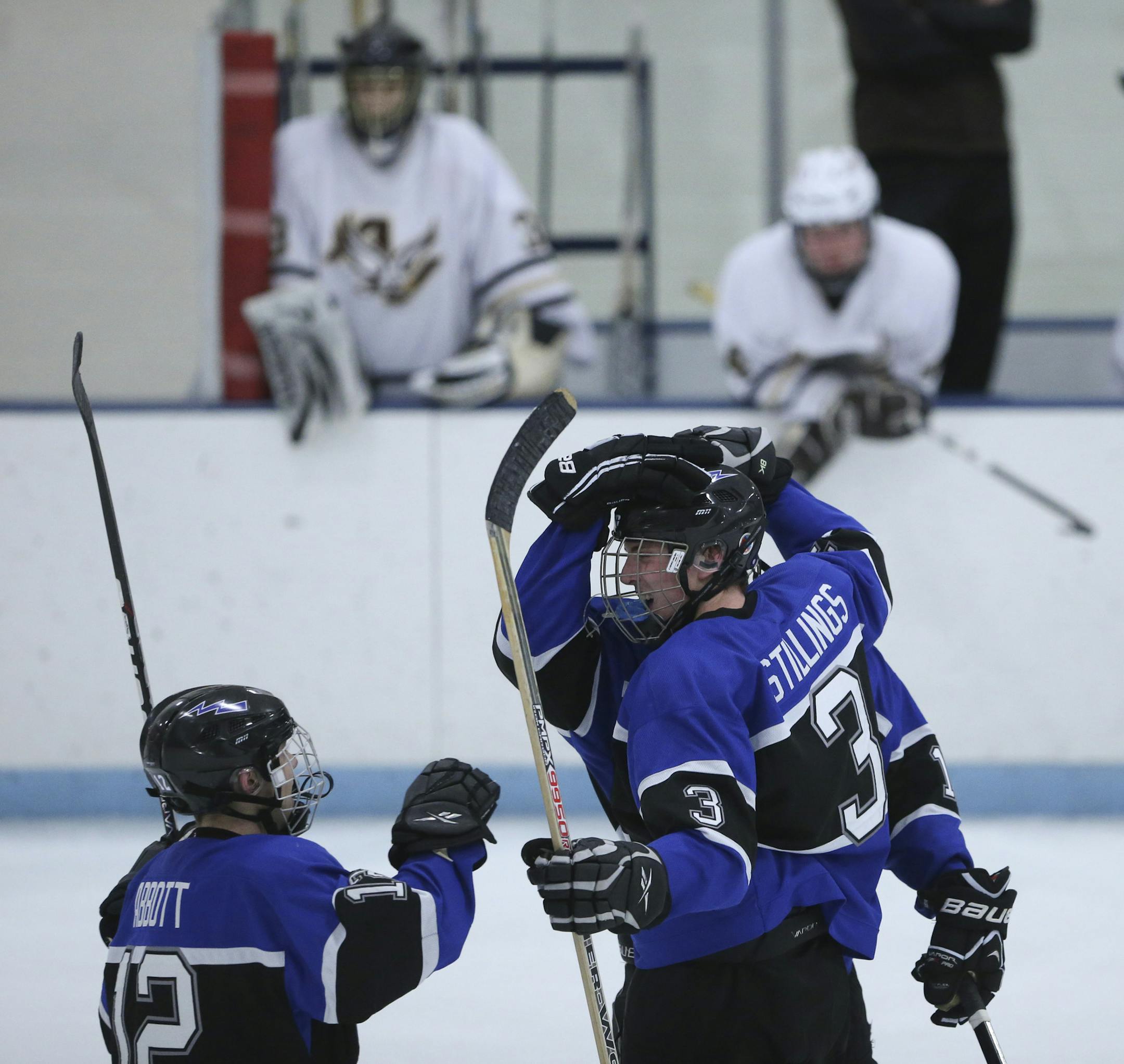 Eastview beat crosstown rival Apple Valley 5-3 Tuesday night, January 29, 2013 at Apple Valley High School. Eastview's Mike Stillings was congratulated on his third period goal by Nick Abbott, left, and Keith Muehlbauer, rear. ] JEFF WHEELER ‚Ä¢ jeff.wheeler@startribune.com