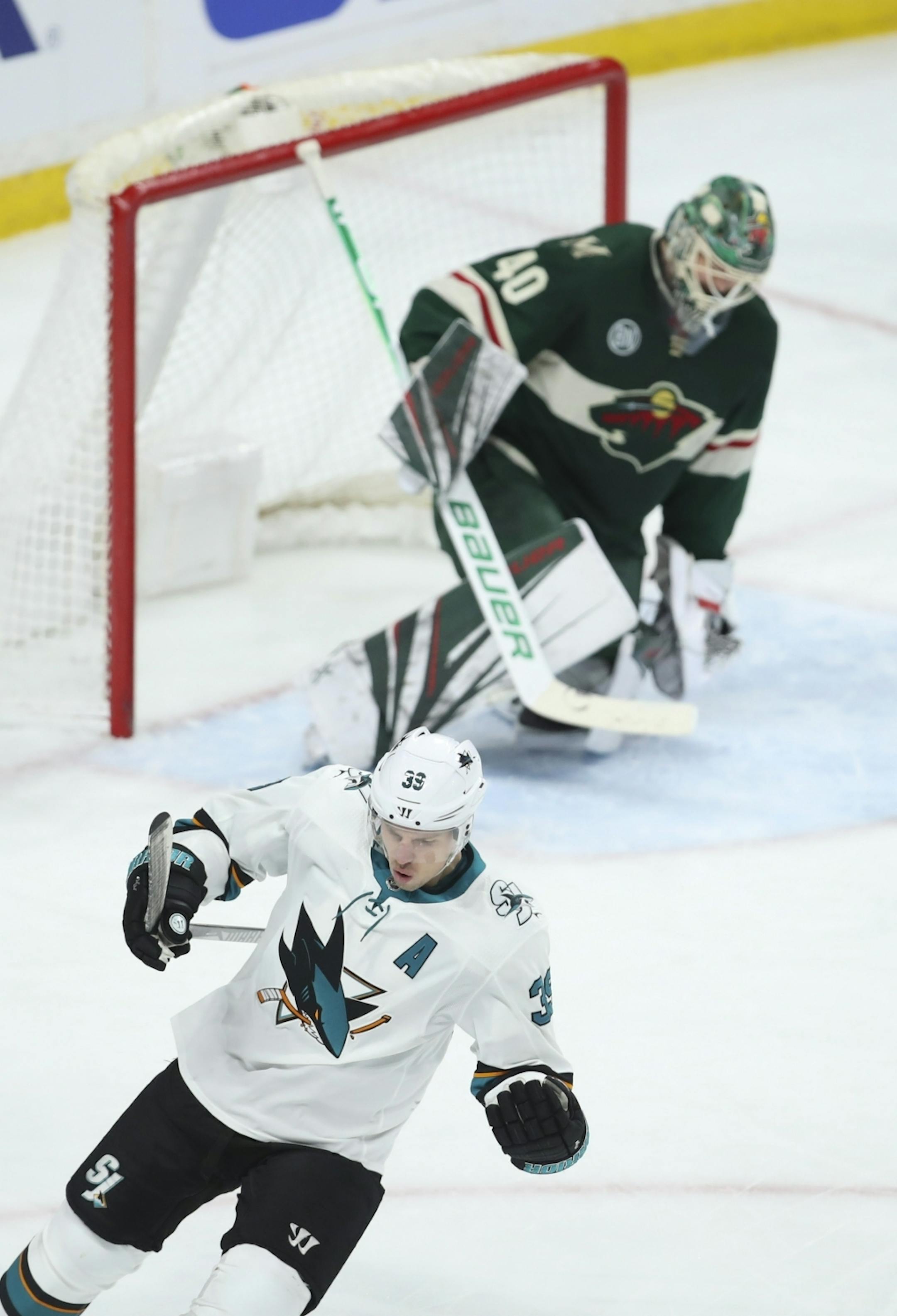 San Jose Sharks center Logan Couture (39) celebrated after he scored on Minnesota Wild goaltender Devan Dubnyk (40) on a penalty shot awarded when Minnesota Wild defenseman Anthony Bitetto (2) was called for hooking on a breakaway in the third period.