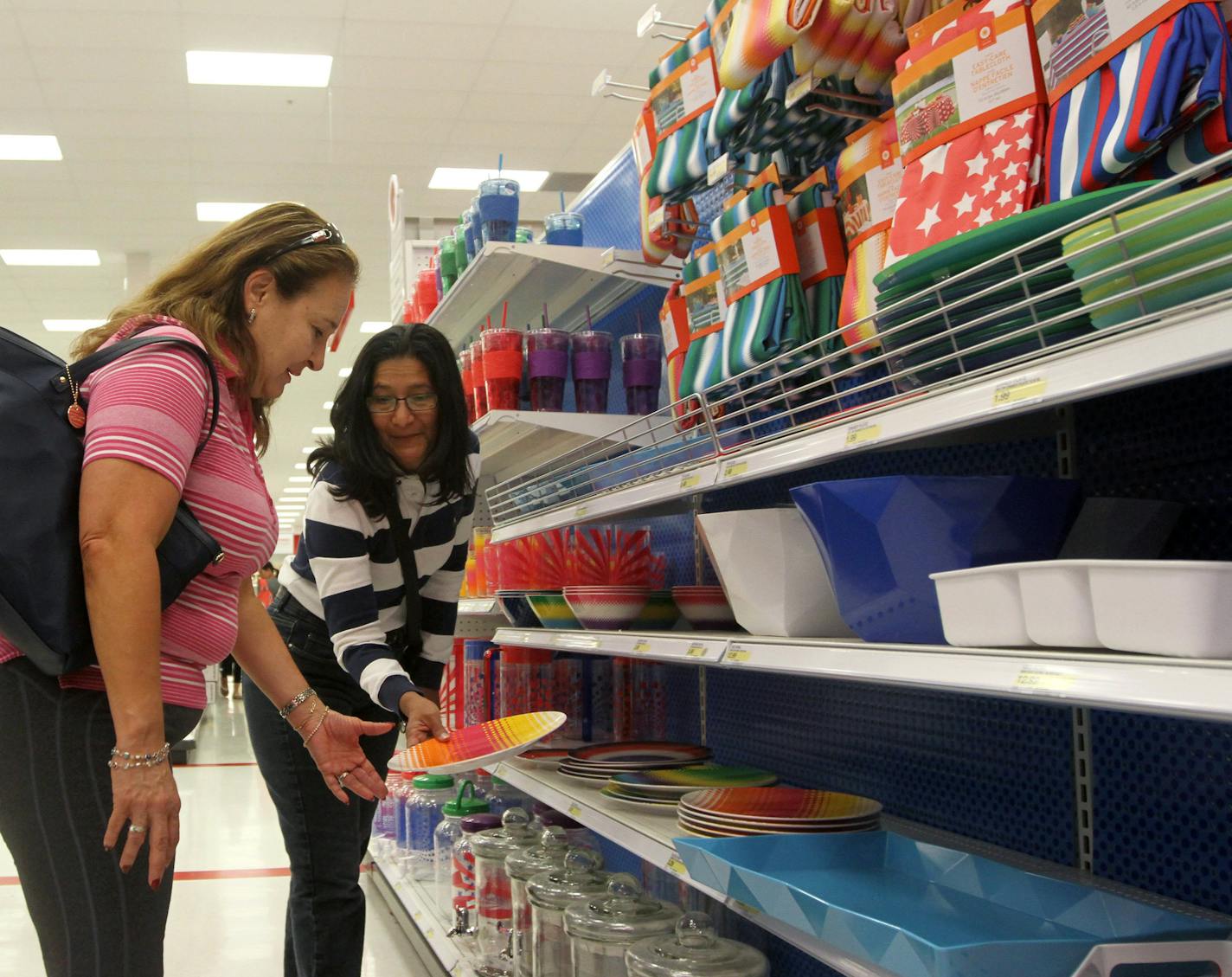 Christina Ryan, Minneapolis Star Tribune Calgary, Alberta: May 15, 2013 -- Claudia Angarita and Mercedes Marenco are thankful they shop at a Target in Canada, and not have to cross that border, in Calgary on May 15, 2013. Photo by Christina Ryan, Minneapolis Star Tribune (For City section story by Tom Lee) ORG XMIT: MIN1305162155411283