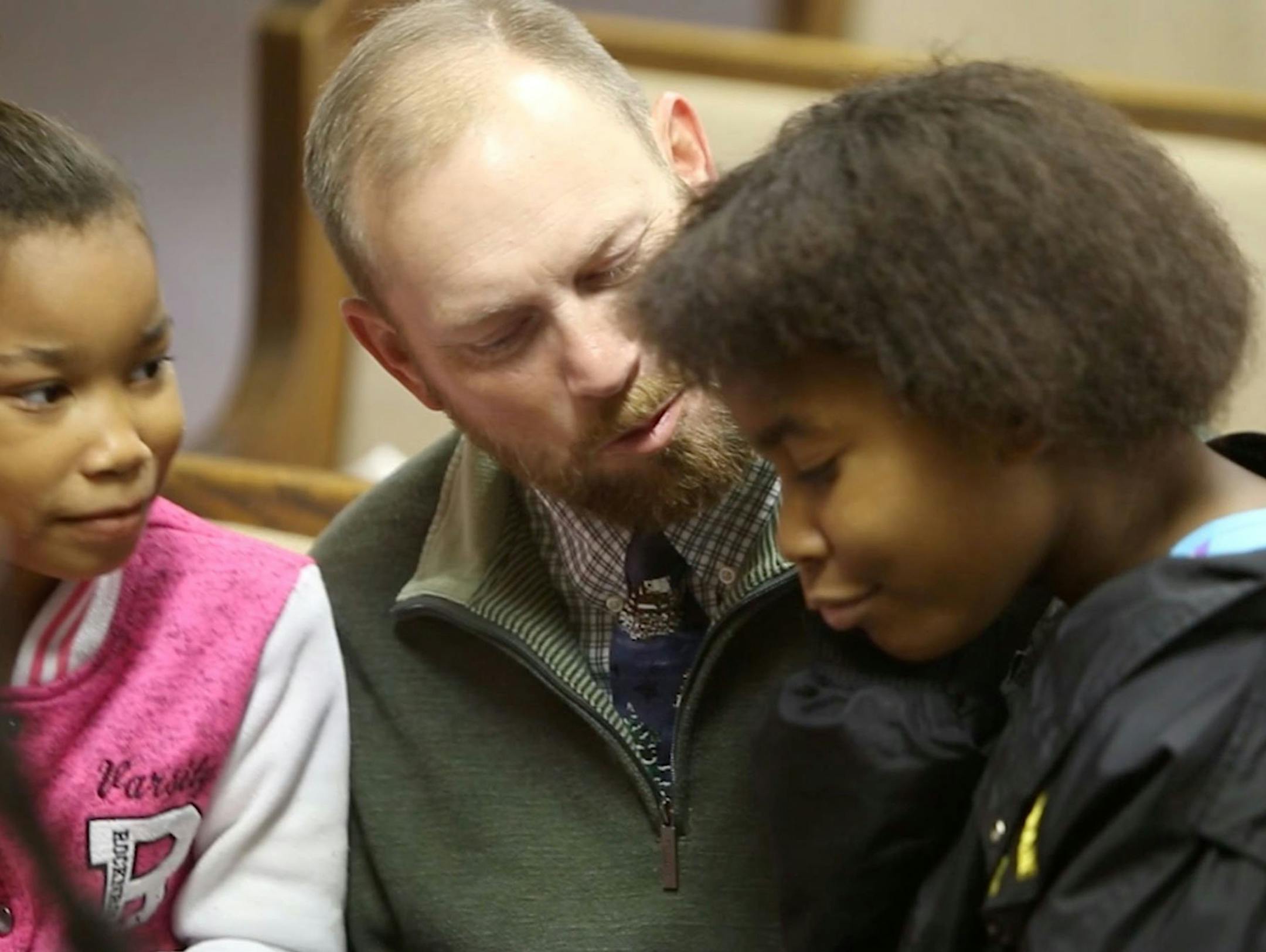 Joey Gilbert of Carnesville, Ga., talks to Alasjah Haynes, 7, of Waveland, and her sister, Jada, 12, before services at Bayside Baptist Church in Waveland on Sunday, Dec. 17, 2017.