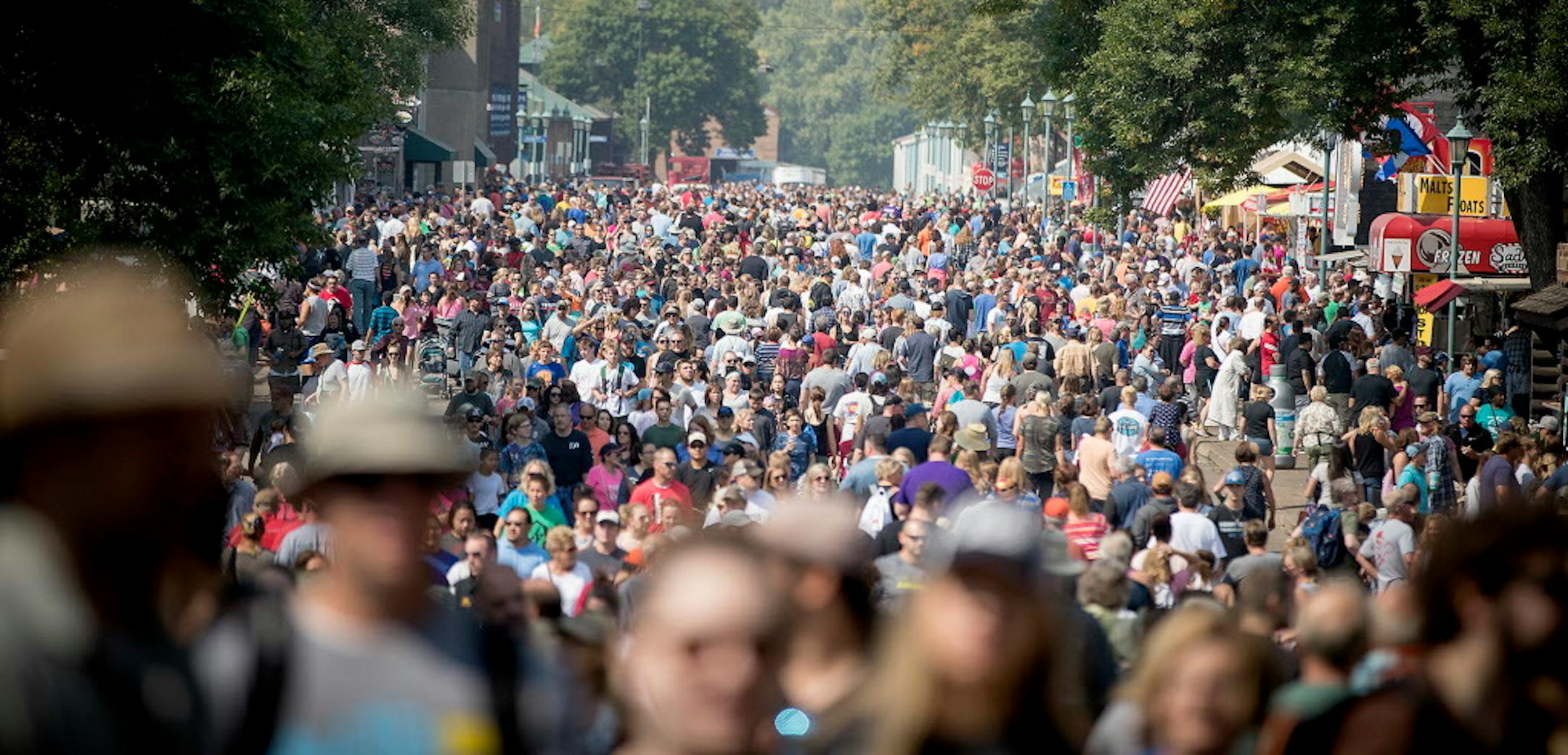 The fair has no car traffic, yet there are streets and sidewalks.