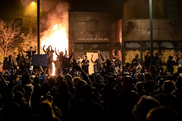The Minneapolis Third Police Precinct is set on fire during a third night of protests following the death of George Floyd while in Minneapolis police 