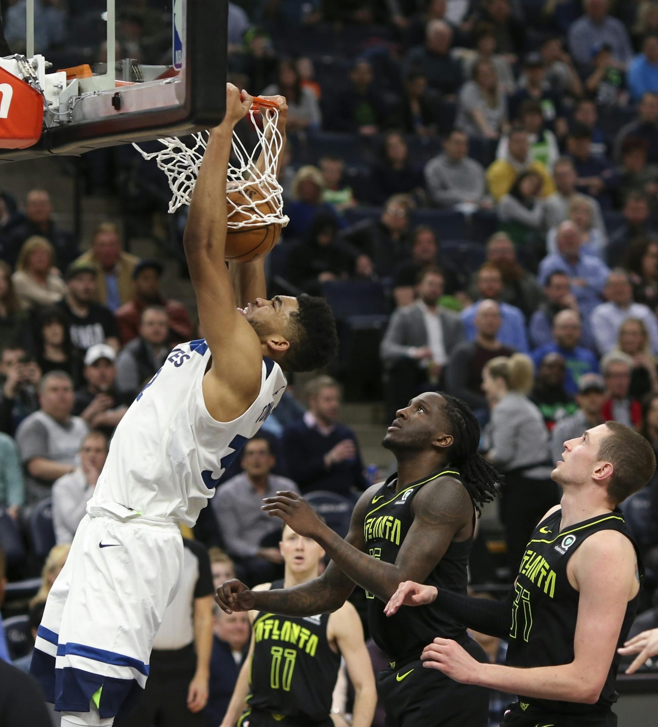 Minnesota Timberwolves center Karl-Anthony Towns (32) with a first half dunk on a night that saw him scoring a franchise-record 56 points.