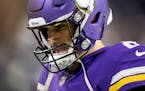 Minnesota Vikings quarterback Kirk Cousins (8) walks off the field at the end of Sunday’s game.