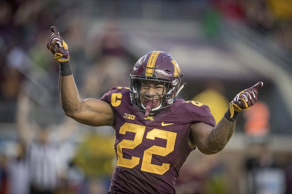 Minnesota running back Kobe McCrary celebrates a 4-yard touchdown run during the fourth quarter against Illinois at TCF Bank Stadium in Minneapolis on