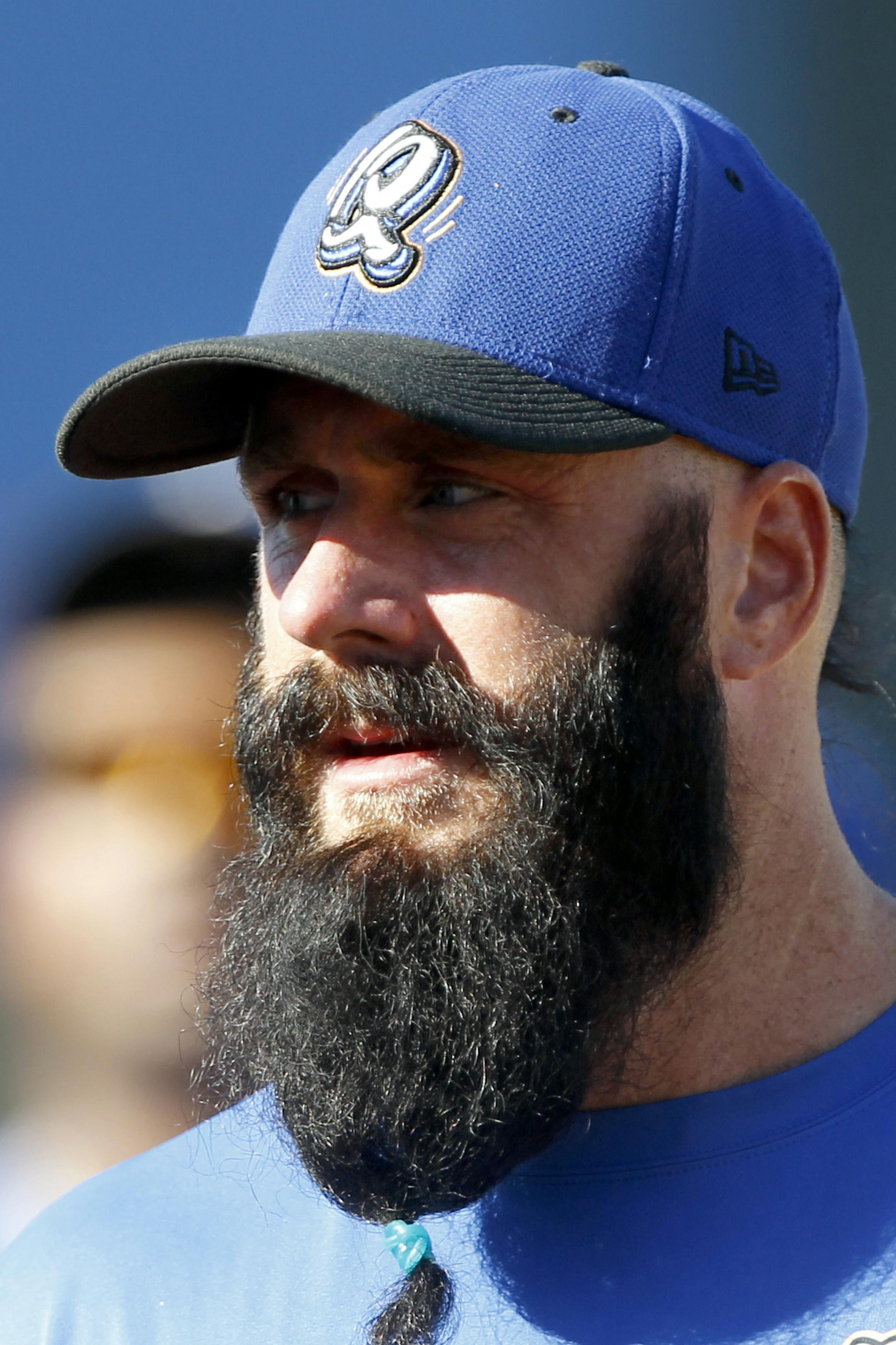 Former Giants pitcher Brian Wilson returns from the outfield during batting practice as he makes his Dodgers organization debut in a baseball game for the A-level Rancho Cucamonga Quakes against the Lake Elsinore Storm on Wednesday, Aug. 7, 2013 in Rancho Cucamonga, Calif. (AP Photo/Alex Gallardo) ORG XMIT: OTKAG104