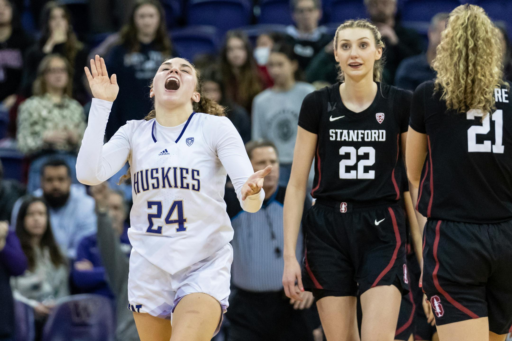 Washington guard Elle Ladine, left, celebrates as Stanford forward Cameron Brink watches during the second half of an NCAA college basketball game, Sunday, Feb. 5, 2023, in Seattle. Washington won 72-67. (AP Photo/Stephen Brashear)