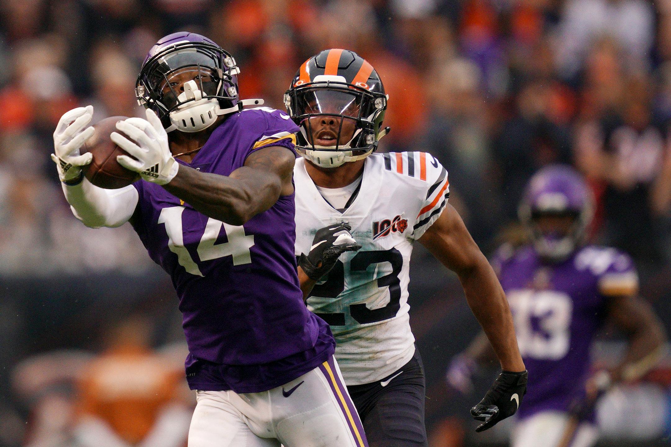 Minnesota Vikings wide receiver Stefon Diggs (14) caught a long pass from quarterback Kirk Cousins (8) as Chicago Bears cornerback Kyle Fuller (23) raced to defend in the third quarter. ] ANTHONY SOUFFLE • anthony.souffle@startribune.com The Minnesota Vikings played the Chicago Bears in an NFL football game Sunday, Sept. 29, 2019 at Soldier Field in Chicago.
