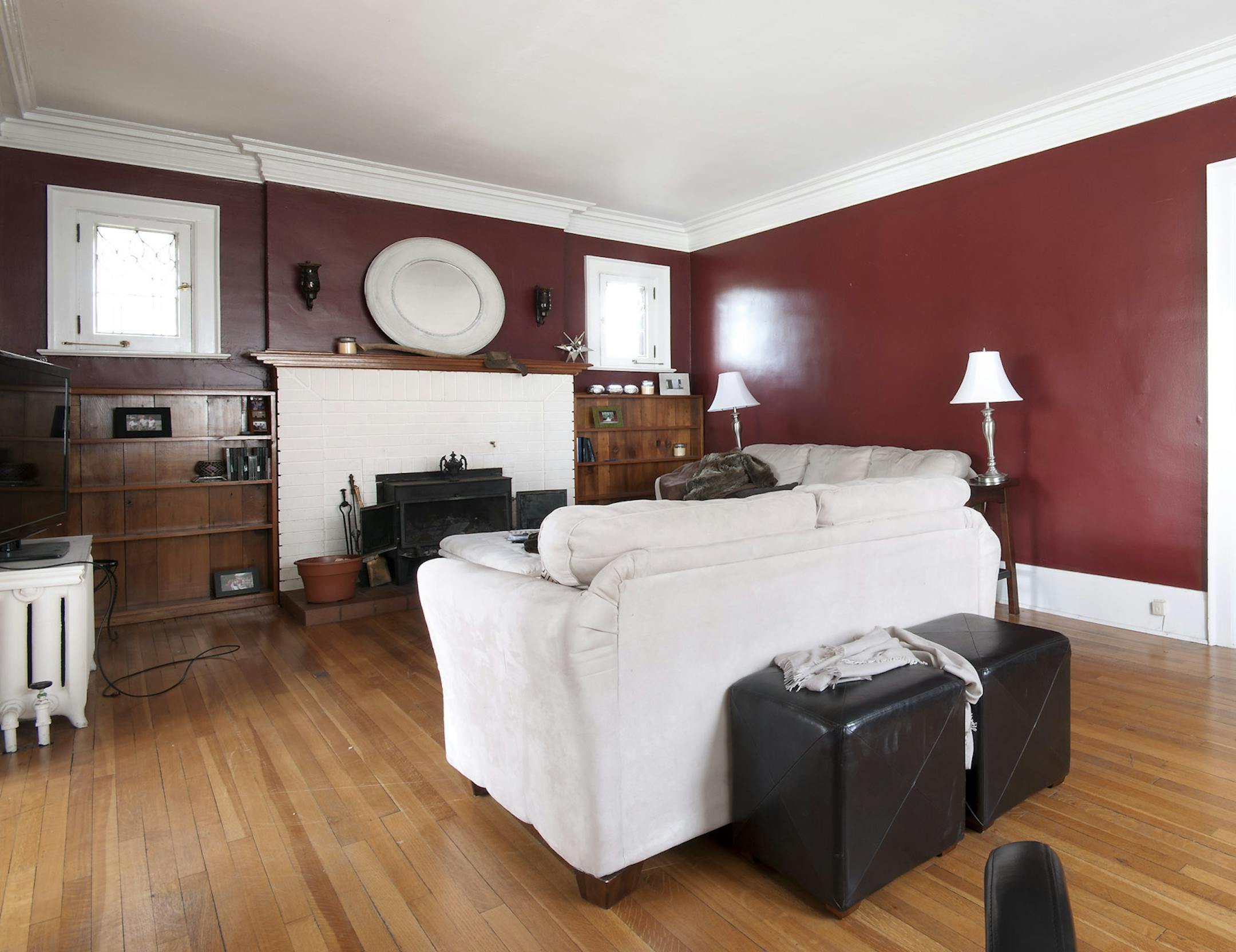 SH12L074CANDICETELLSALL Dec. 10, 2012 -- Marianne and Mike's living room had poor lighting, uneven walls and intrusive radiators, to name just a few problems. (SHNS photo courtesy HGTV)