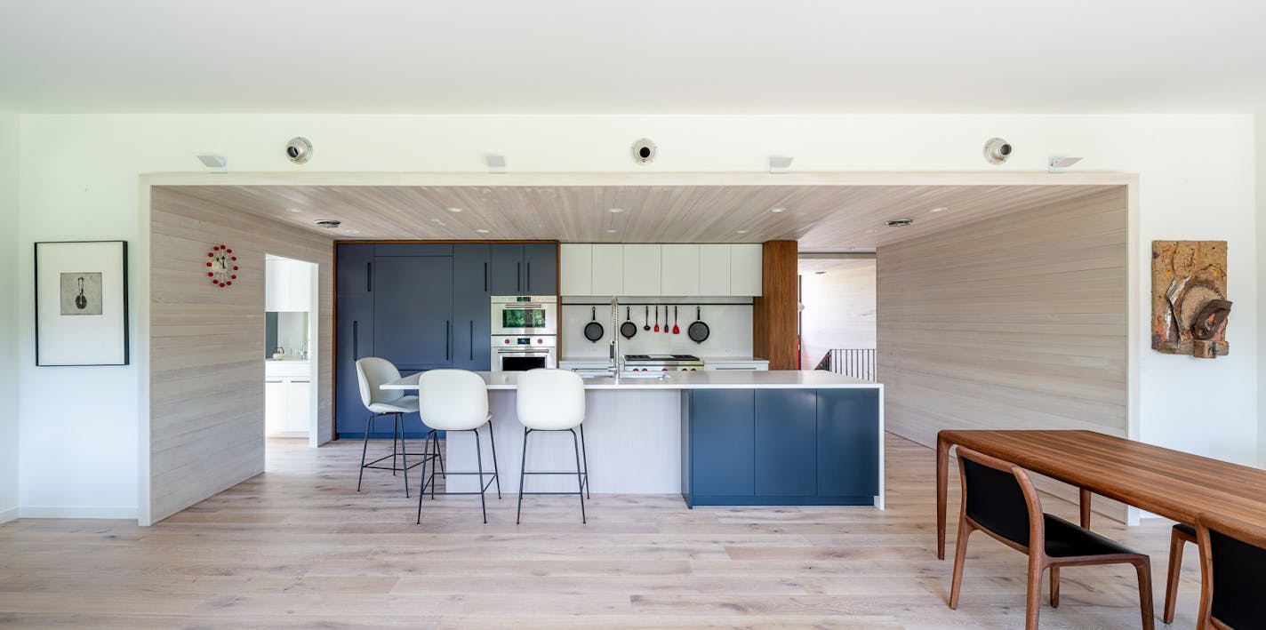 The redesigned home in Golden Valley was envisioned as a series of four boxes. The new kitchen is wrapped in whitewashed fir.