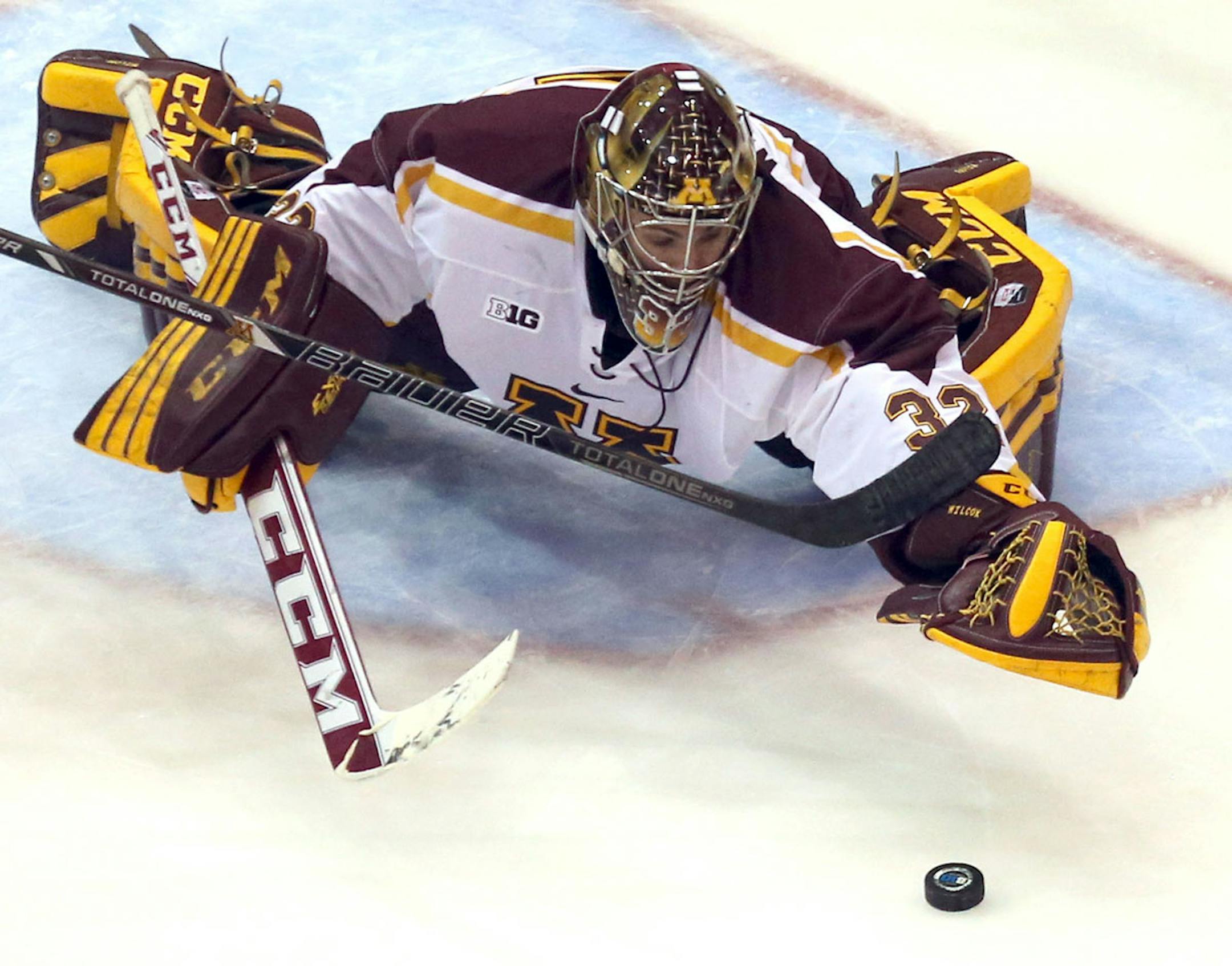 Gopher goalie Adam Wilcox dove after the puck during the third period at Mariucci Arena in Minneapolis, Min., Friday, November 15, 2013 Gophers won against the Minnesota State Mavericks ] (KYNDELL HARKNESS/STAR TRIBUNE) kyndell.harkness@startribune.com