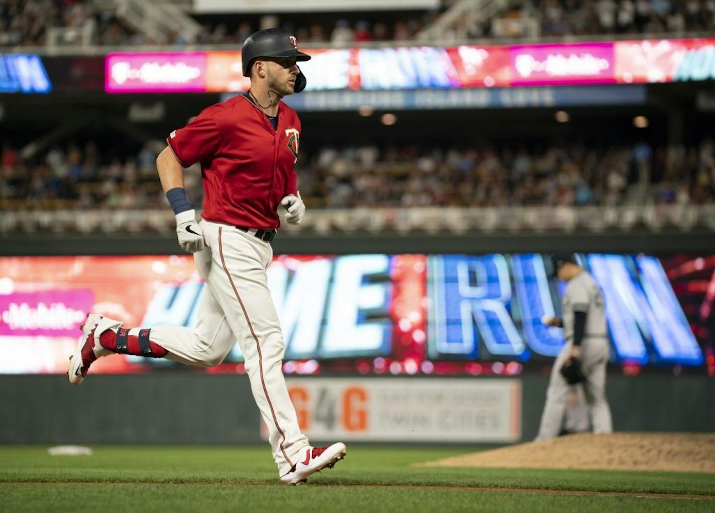 Minnesota Twins catcher Mitch Garver (18) trotted home after hitting a solo home run in the 6th inning off New York Yankees relief pitcher Luis Cessa, rear.