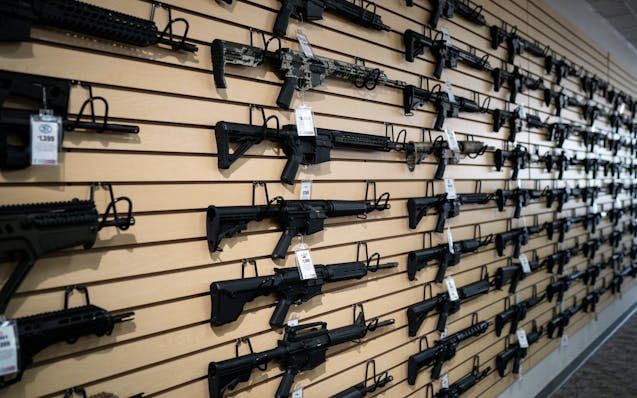 Semi-automatic rifles, including some AR-15s, on display at Bill's Gun Shop in Robbinsdale in 2019.