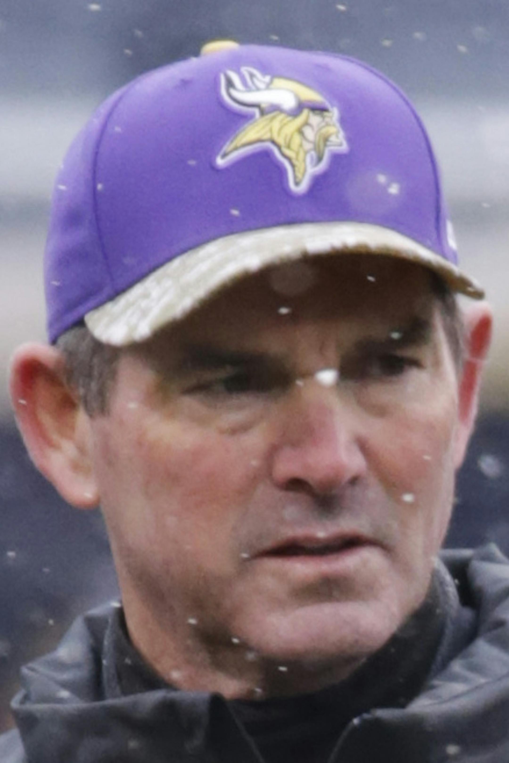 Minnesota Vikings head coach Mike Zimmer walks around the field during warmups before an NFL football game against the Chicago Bears Sunday, Nov. 16, 2014 in Chicago. (AP Photo/Charles Rex Arbogast)