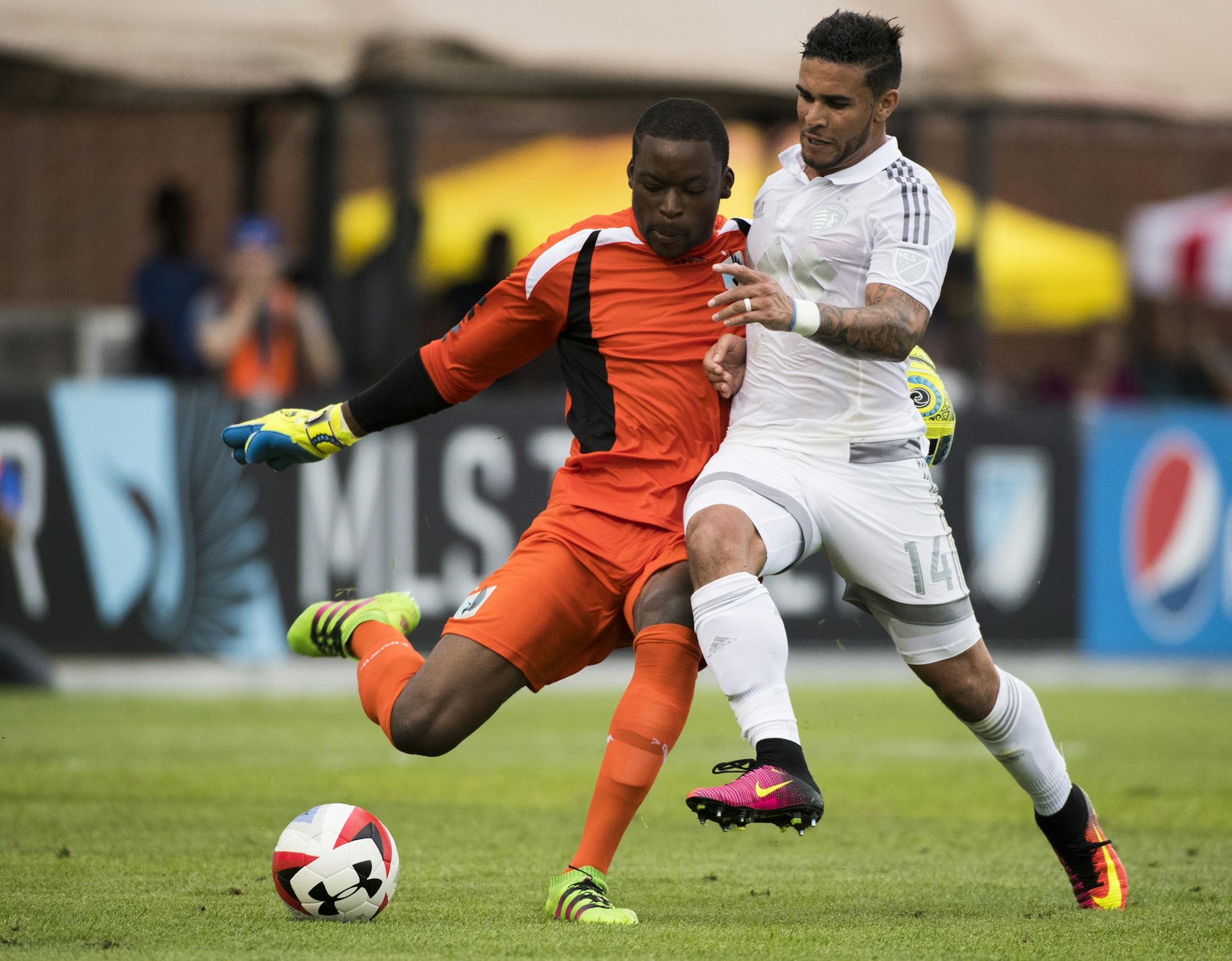 Minnesota United FC goalkeeper Sammy Ndjock (33) kicks the ball away from Sporting Kansas City forward Dom Dwyer (14) in the first half. ] Isaac Hale ï isaac.hale@startribune.com Minnesota United took on Sporting Kansas City in Blaine, MN, at National Sports Center on Wednesday, June 15, 2016.