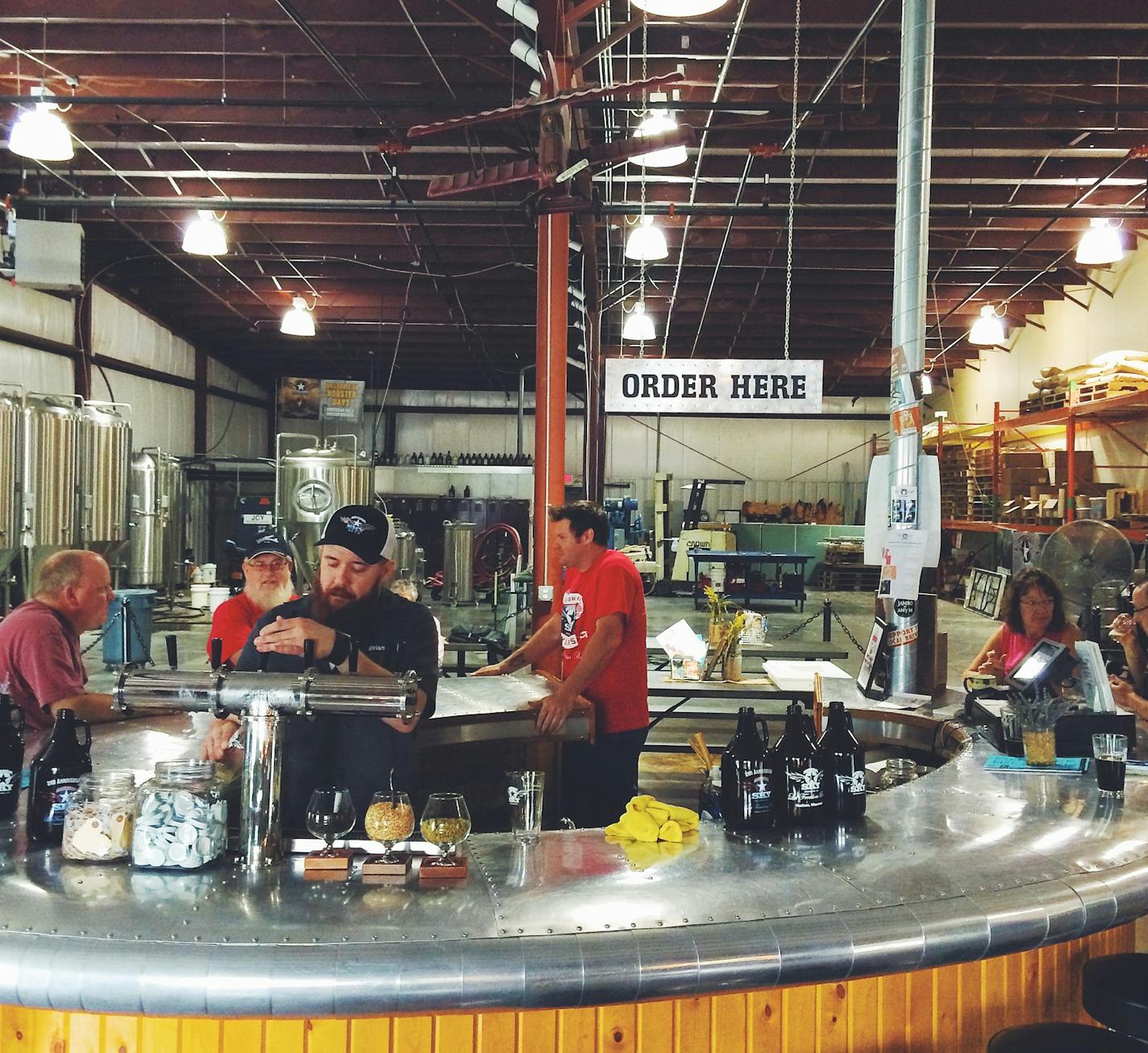 Assistent-brewer Brian Priefer pours a beer at American Sky Brewing in Hudson, Wis.