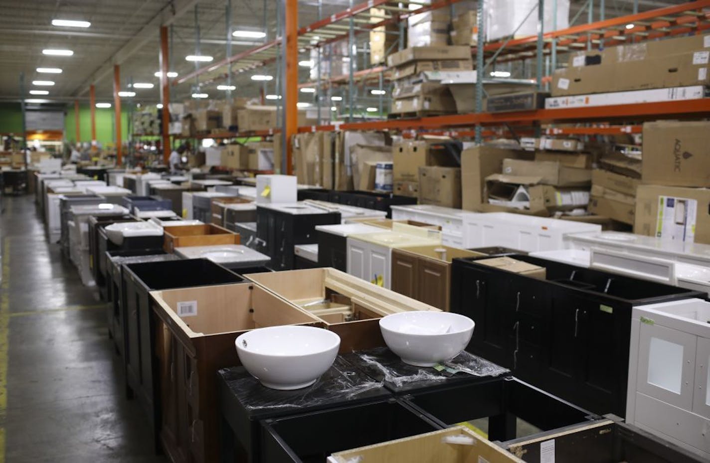 Rows of bathroom vanities in MN Home Outlet's warehouse location.