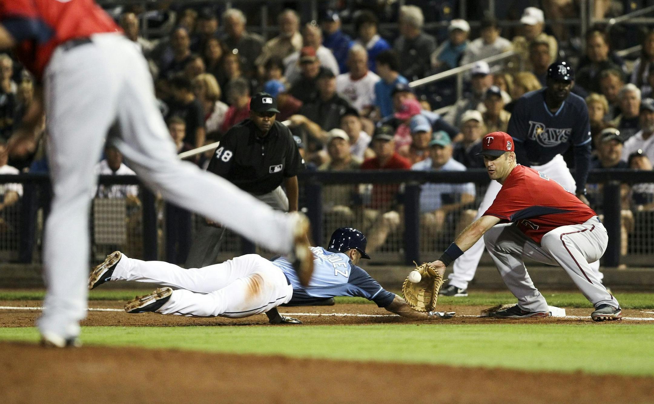 Tampa Bay Rays left fielder Sean Rodriguez (1) jumps back to first base in the sixth inning during a Grapefruit League game against the Minnesota Twins at Charlotte Sports Park in Port Charlotte, Fla., on Thursday, March 20, 2014. (Will Vragovic/Tamps Bay Times/MCT)