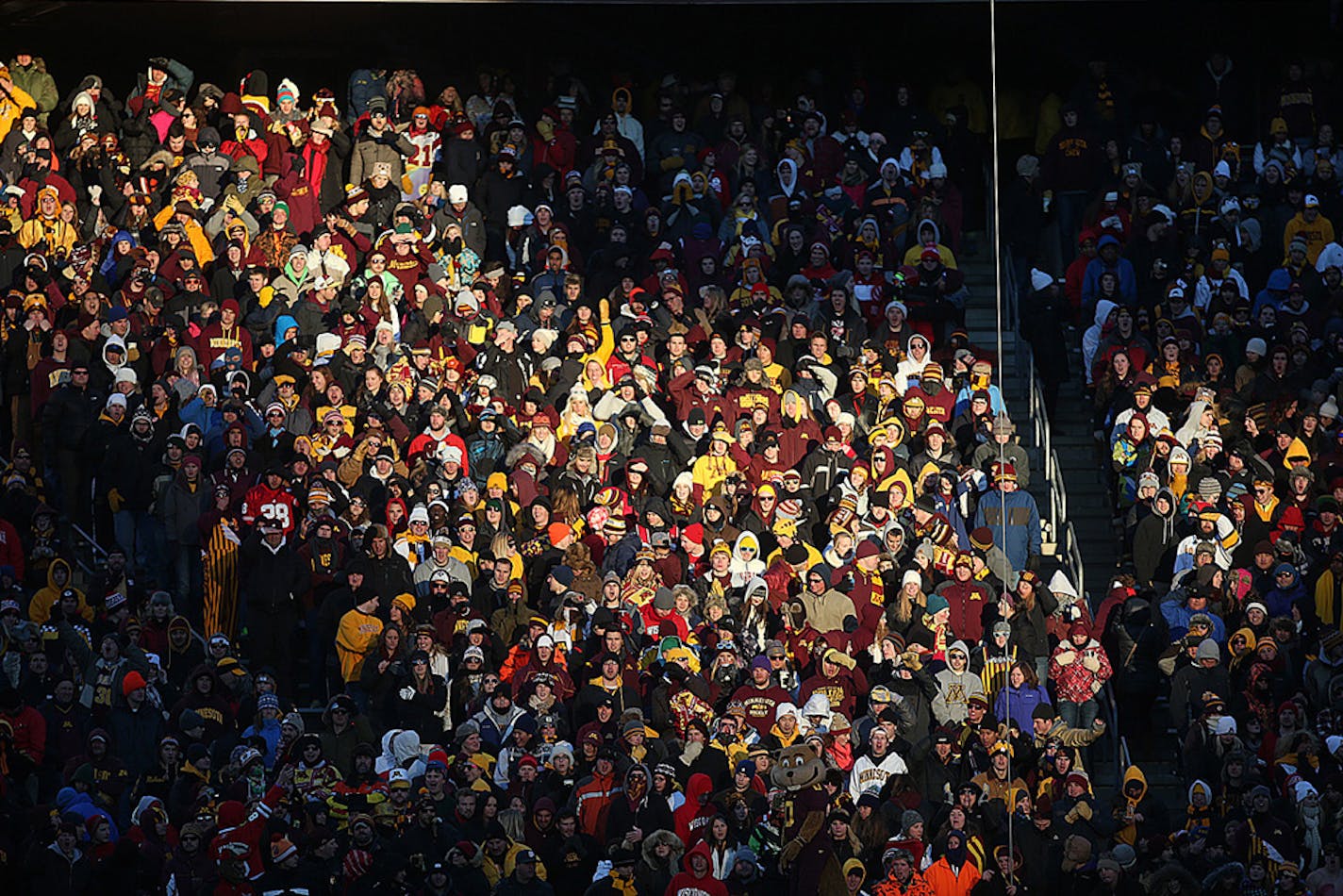 A ribbon of sunlight warmed fans in the lower seating area during the game against Wisconsin Badgers at TCF Bank Stadium last November. Wisconsin won the game 20-7.