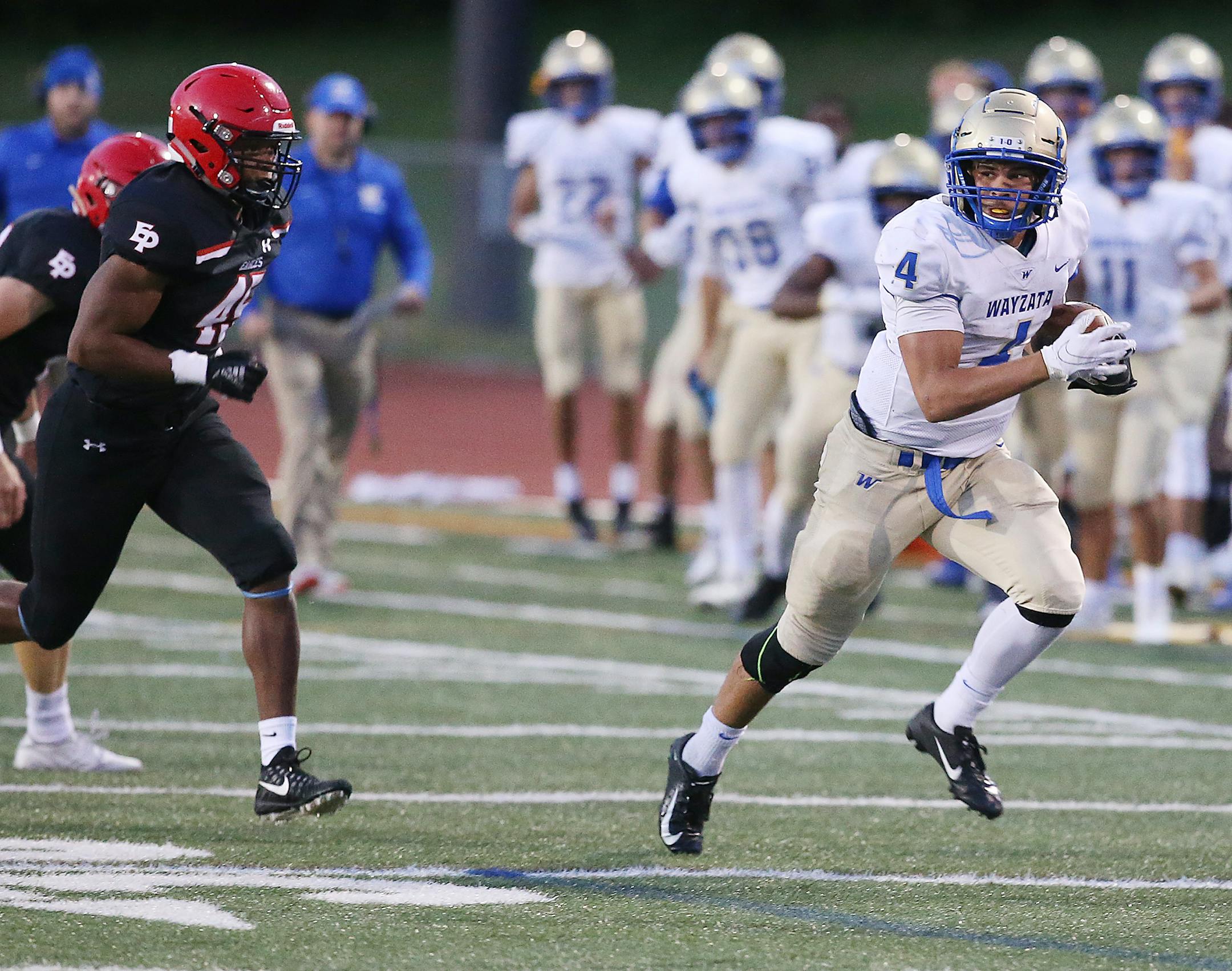 Wayzata running back Christian Vasser turned it outside and up the field for a long run, eluding Eden Prairie tackler Justice Sullivan.