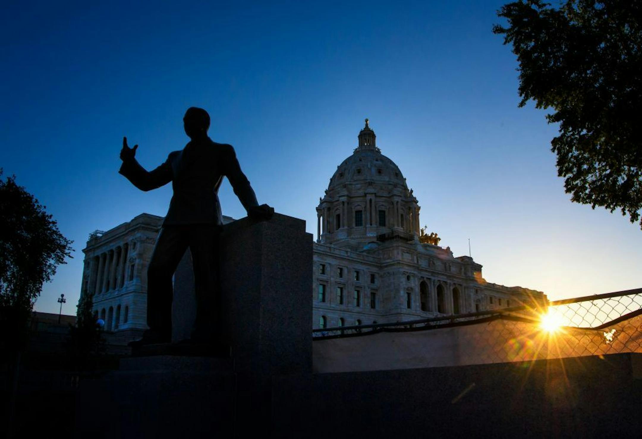 As the sun rose behind the Minnesota State Capitol, lawmakers continued their work inside in their all night special session that continues into Wednesday. Major bills are still unresolved.