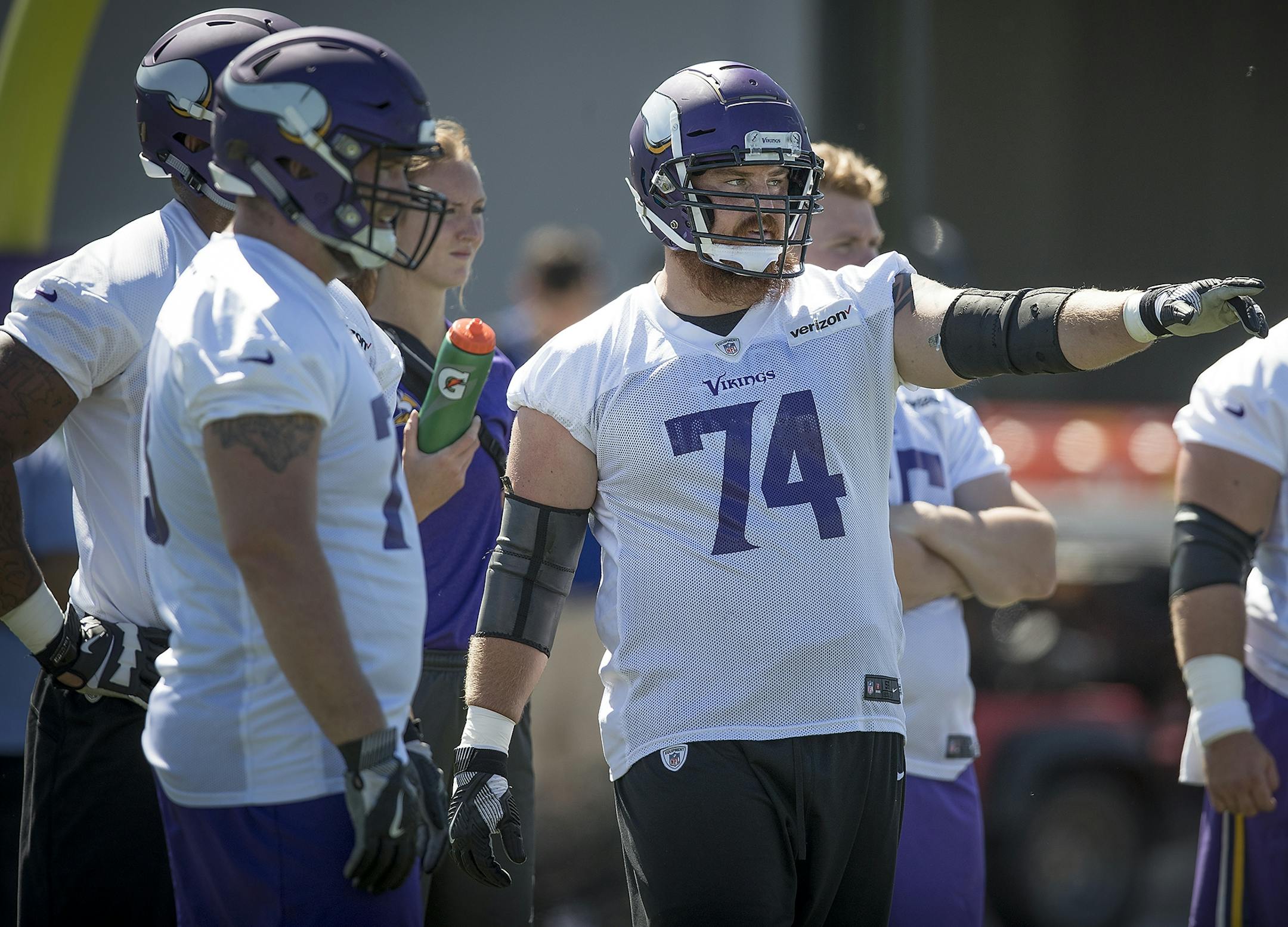 Vikings tackle Mike Remmers, right, ran drills during the Vikings three-day minicamp in June.