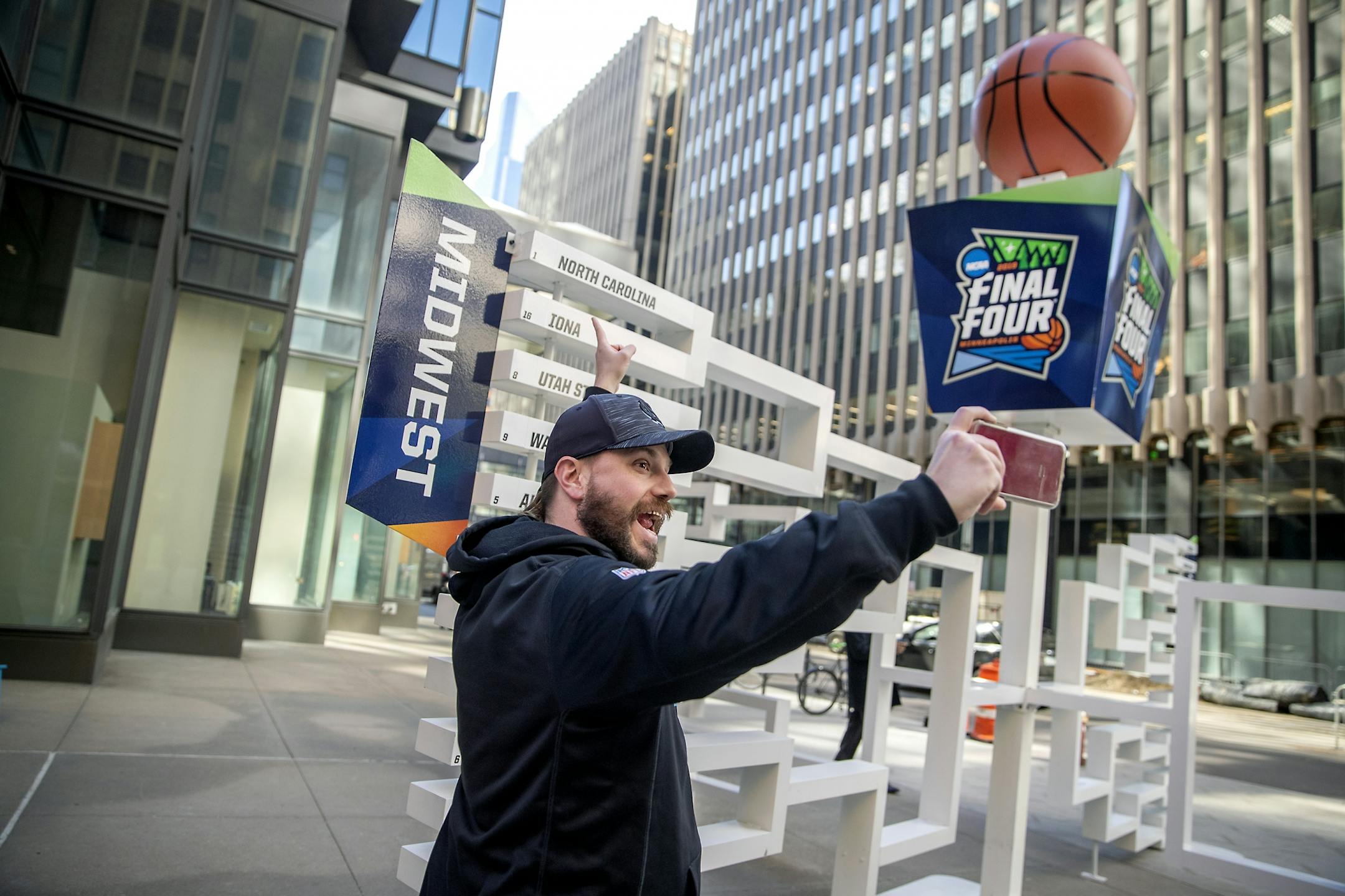 Brad Hardin took a selfie as he found his favorite team, North Carolina, on a 3D sculpture of the Final Four bracket on the Nicollet Mall just outside the IDS tower, Monday, March 18, 2019 in Minneapolis, MN.