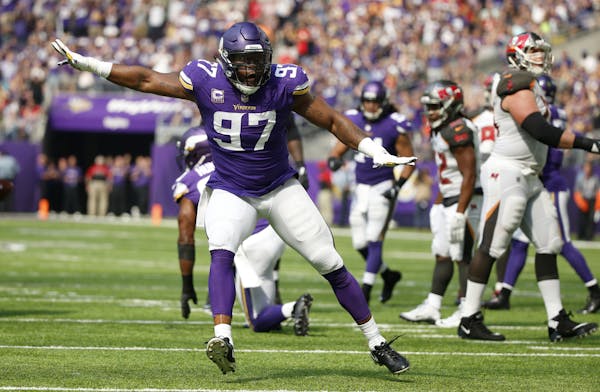 Minnesota Vikings defensive end Everson Griffen (97) celebrates after sacking Tampa Bay Buccaneers quarterback Jameis Winston during the first half of