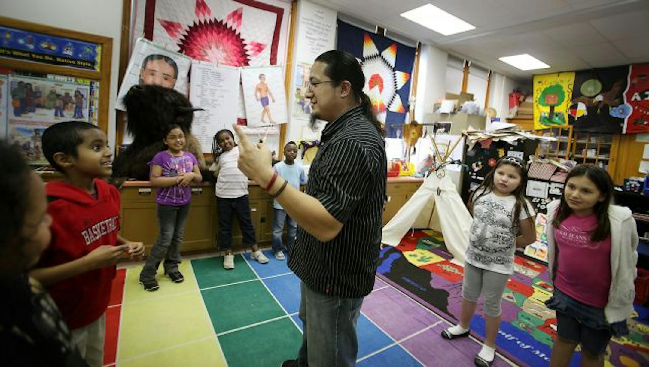 Thomas Draskovic, a Lakota language teacher at the American Indian Magnet School in St. Paul, works with his third-grade students on the Lakota words for the numbers during class on Thursday.