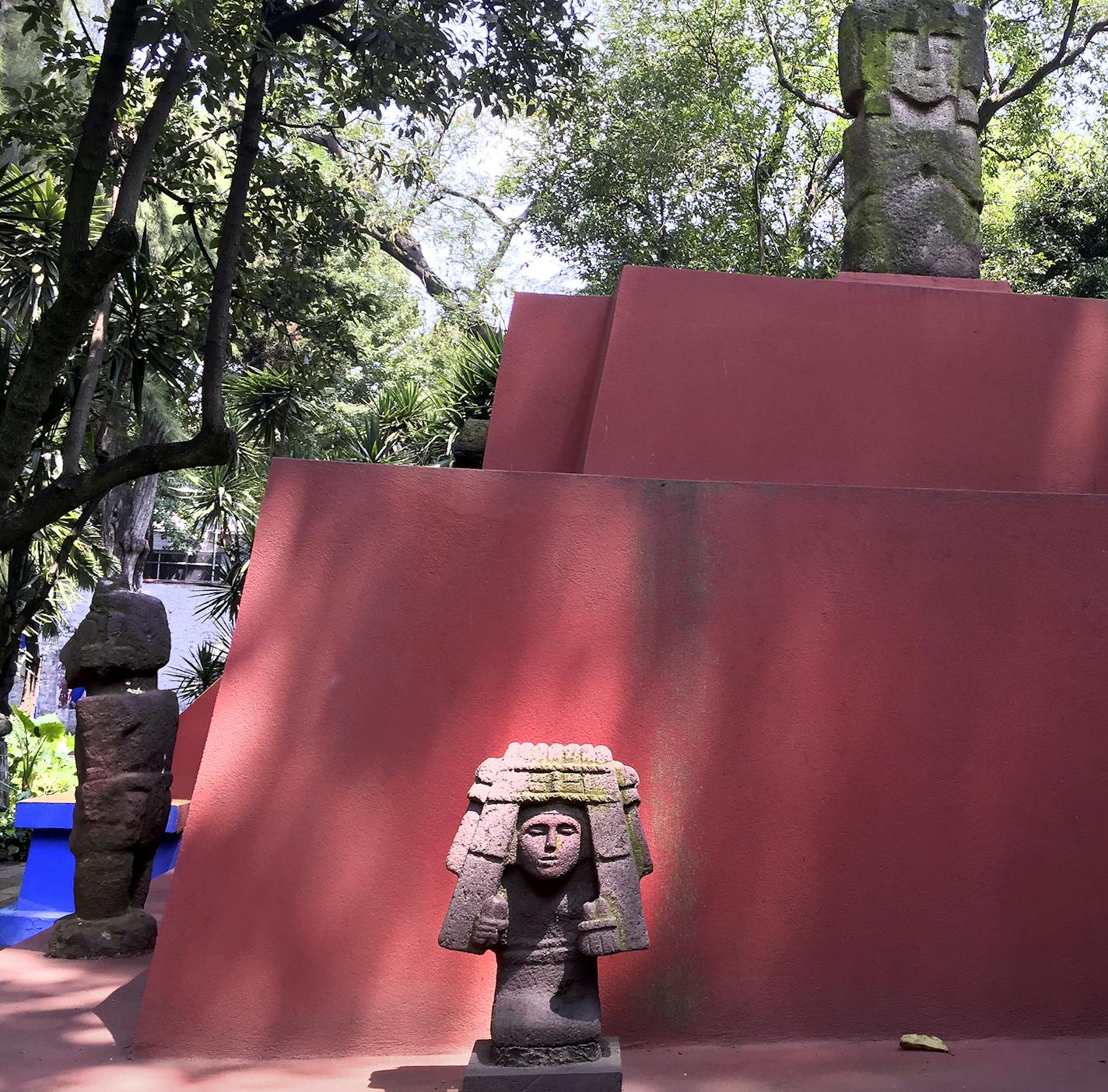 Statues are artfully placed throughout Frida Kahlo&#x2019;s courtyard garden, which has become a popular tourist destination in Mexico City.