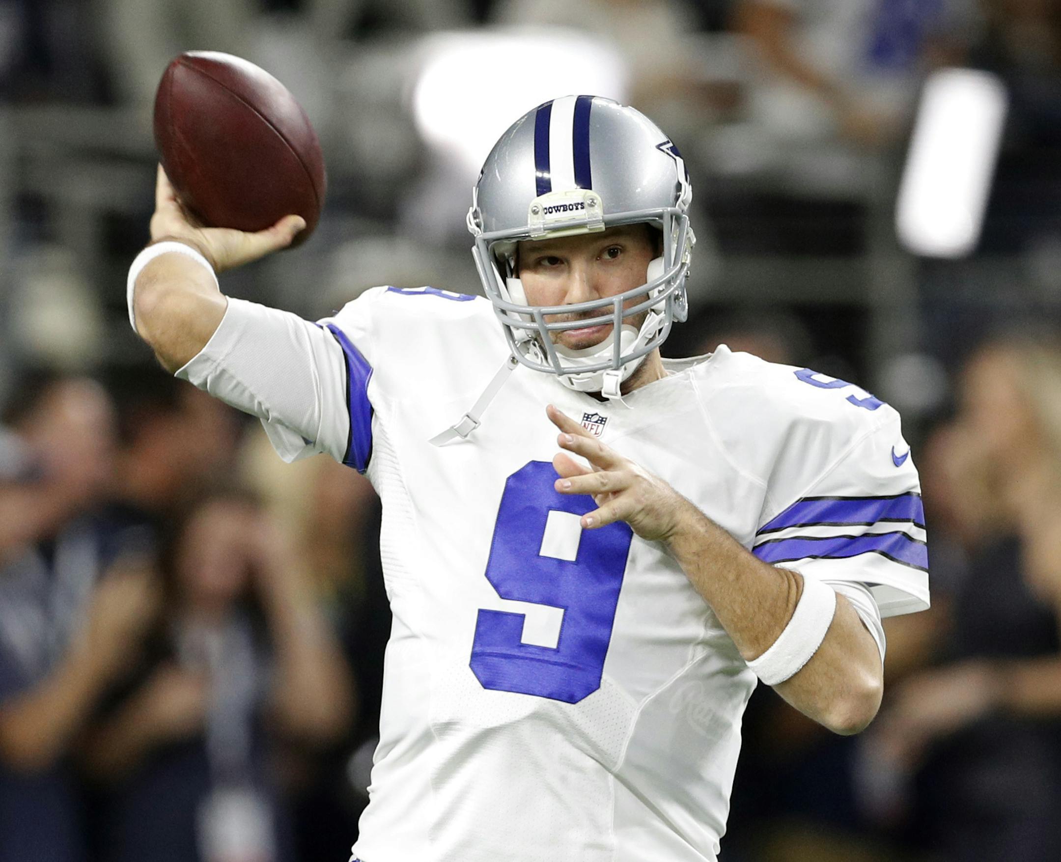 Dallas Cowboys' Tony Romo throws a pass during warm ups before an NFL football game against the Detroit Lions on Monday, Dec. 26, 2016, in Arlington, Texas. (AP Photo/Brandon Wade)