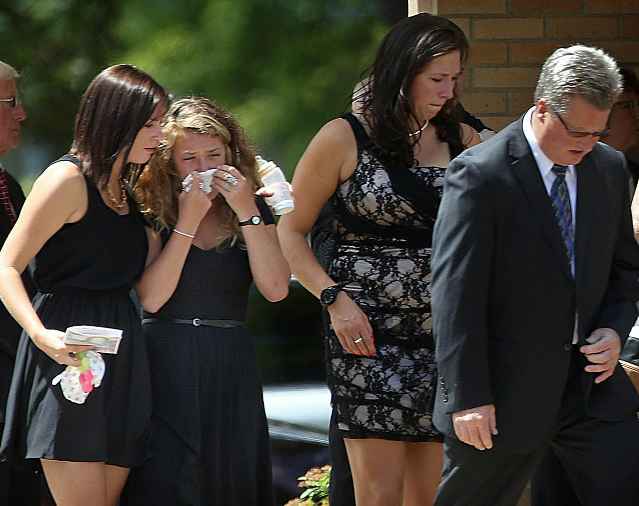 Pallbearers walked away from the hearse following the funeral service for Lila Warwick held Saturday at Redeemer Lutheran Church in Willmar, Minn.