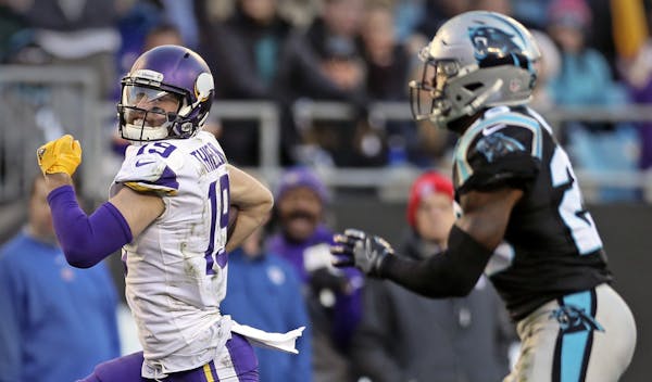 Vikings Adam Thielen breaks away from Panthers Mike Adams on his way to a 52 yard TD after a short pass from Case Keenum in the 4th quarter. ] Minneso