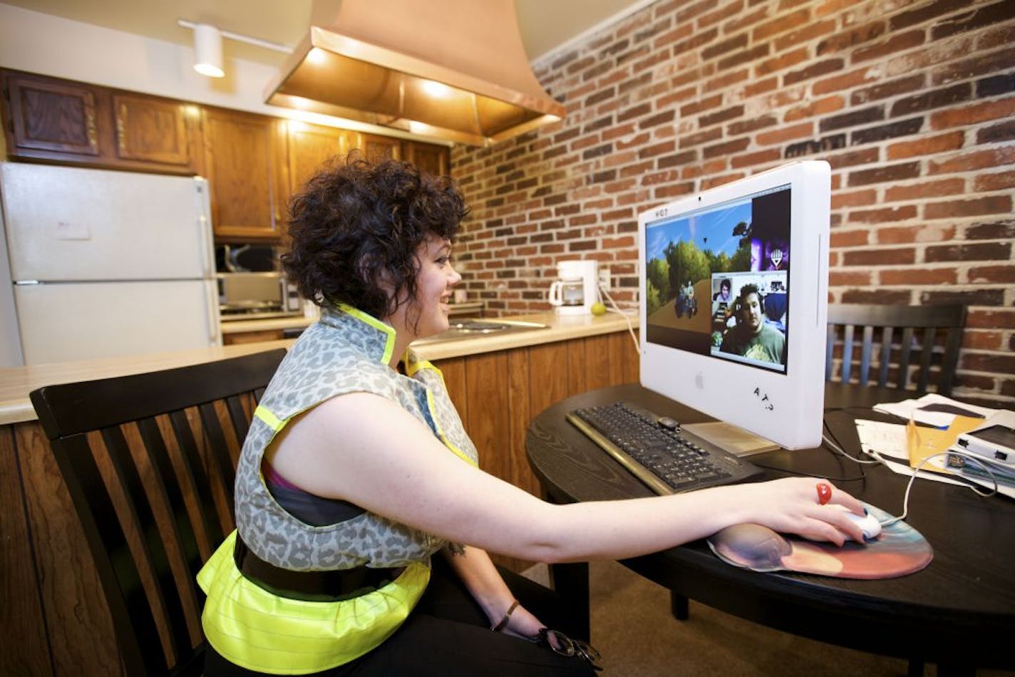 Tamara Langman plays World of Warcraft with her boyfriend, John Bentley, on screen, whom she met while playing the game.