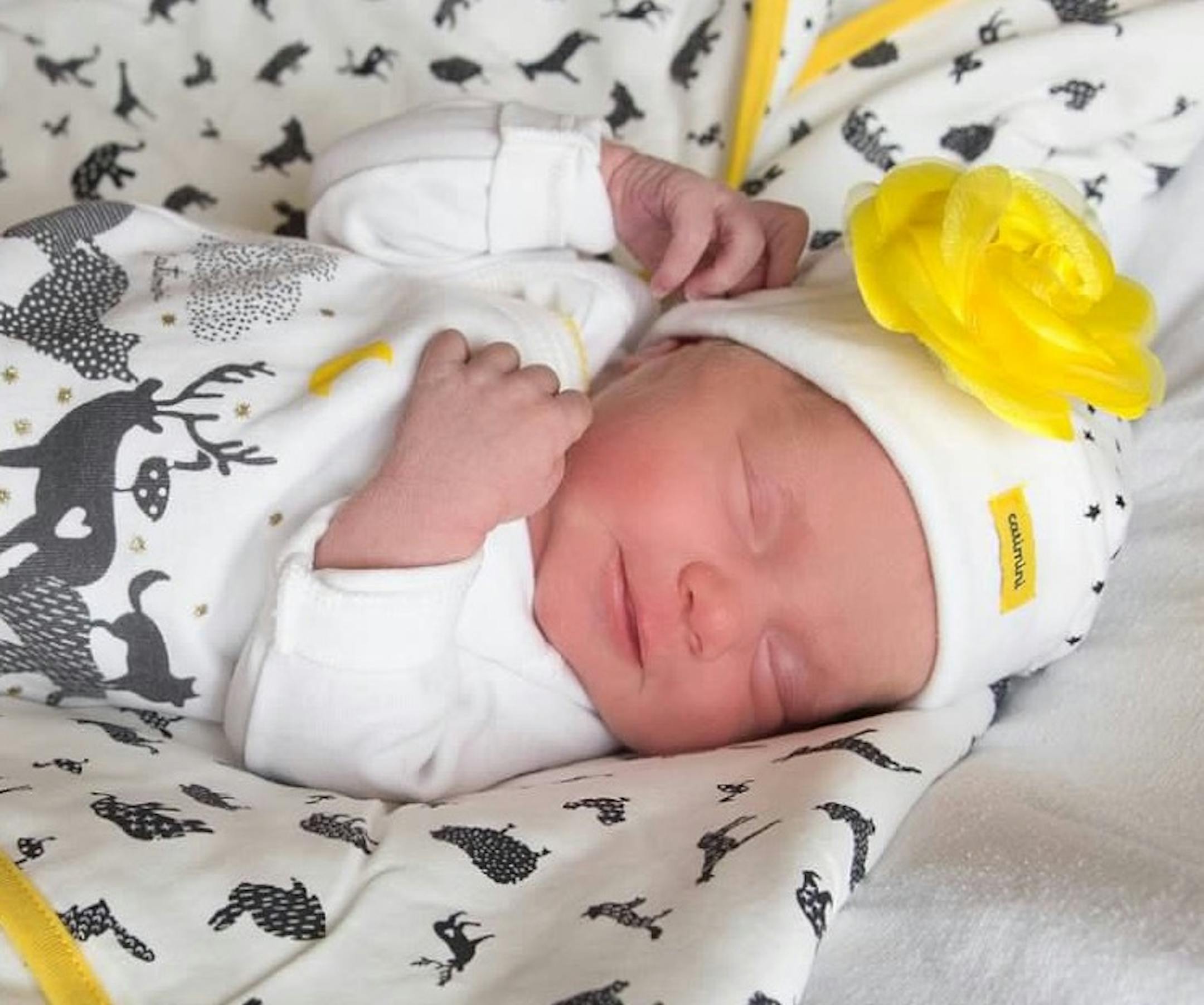 Baby Coco, so joyful at 12 hours old.