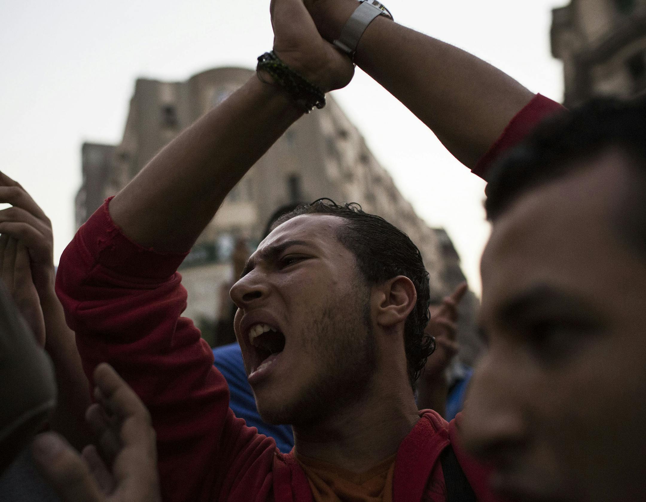 Egyptian youths chant slogans during a demonstration in support of Egyptian political satirist Bassem Youssef after a local TV station stops the airing of his show in Cairo, Egypt, Saturday Nov. 2, 2013. A prominent Egyptian statesman criticized Saturday a local TV station for stopping the airing of a widely popular satire show by Youssef, describing the decision as unwise and harmful to the country. (AP Photo/Manu Brabo)