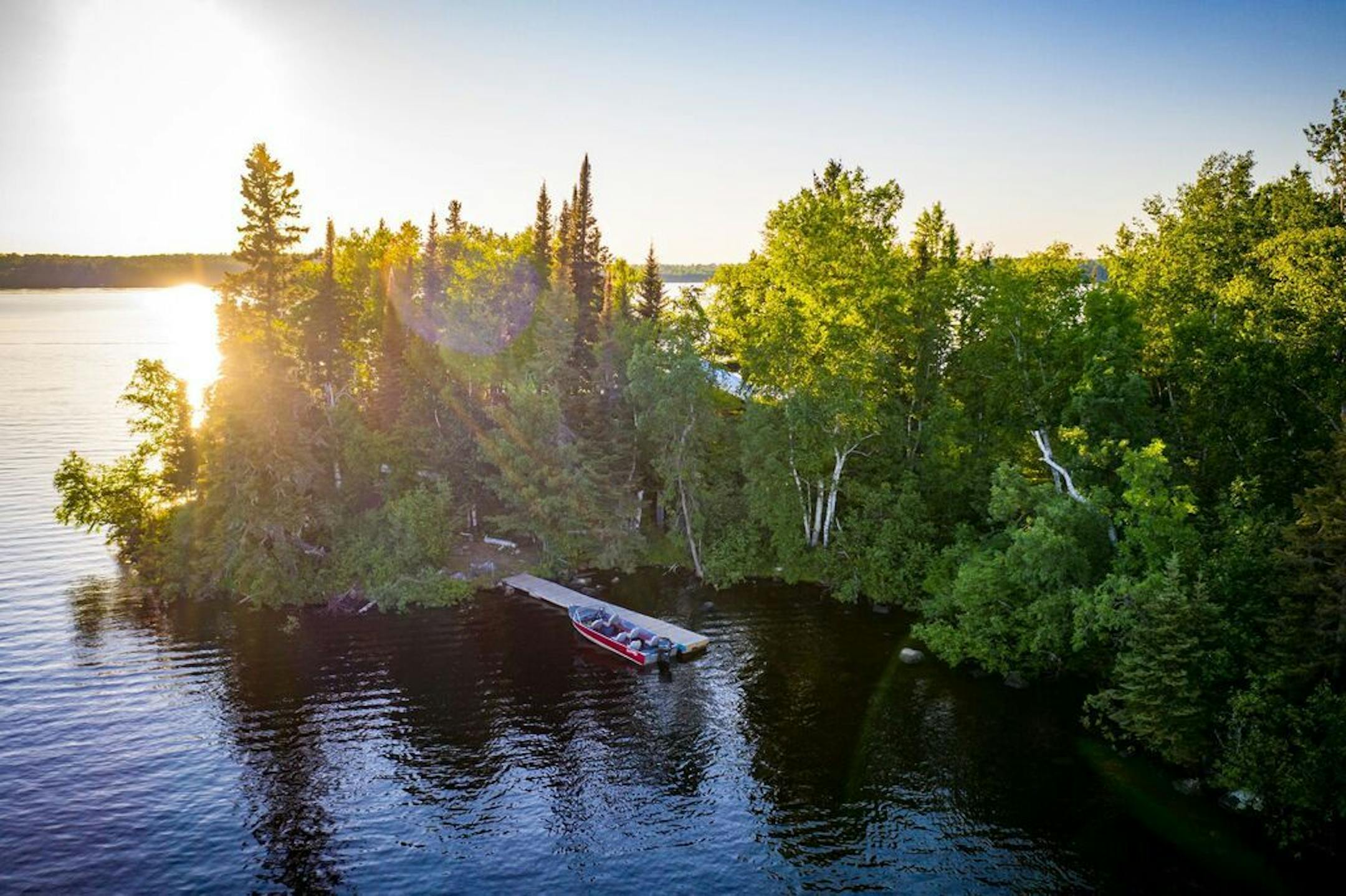 Accessible by boat, the island comes with a small parcel of land and a dock on the mainland.