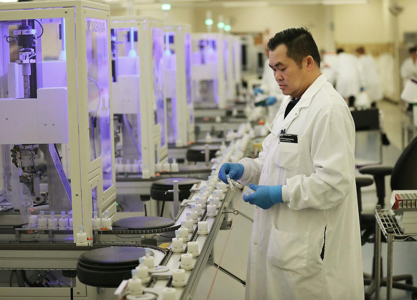 Lab technologists placed specimens onto the specimen distribution system at the Mayo Clinic's Superior Drive facility in Rochester.