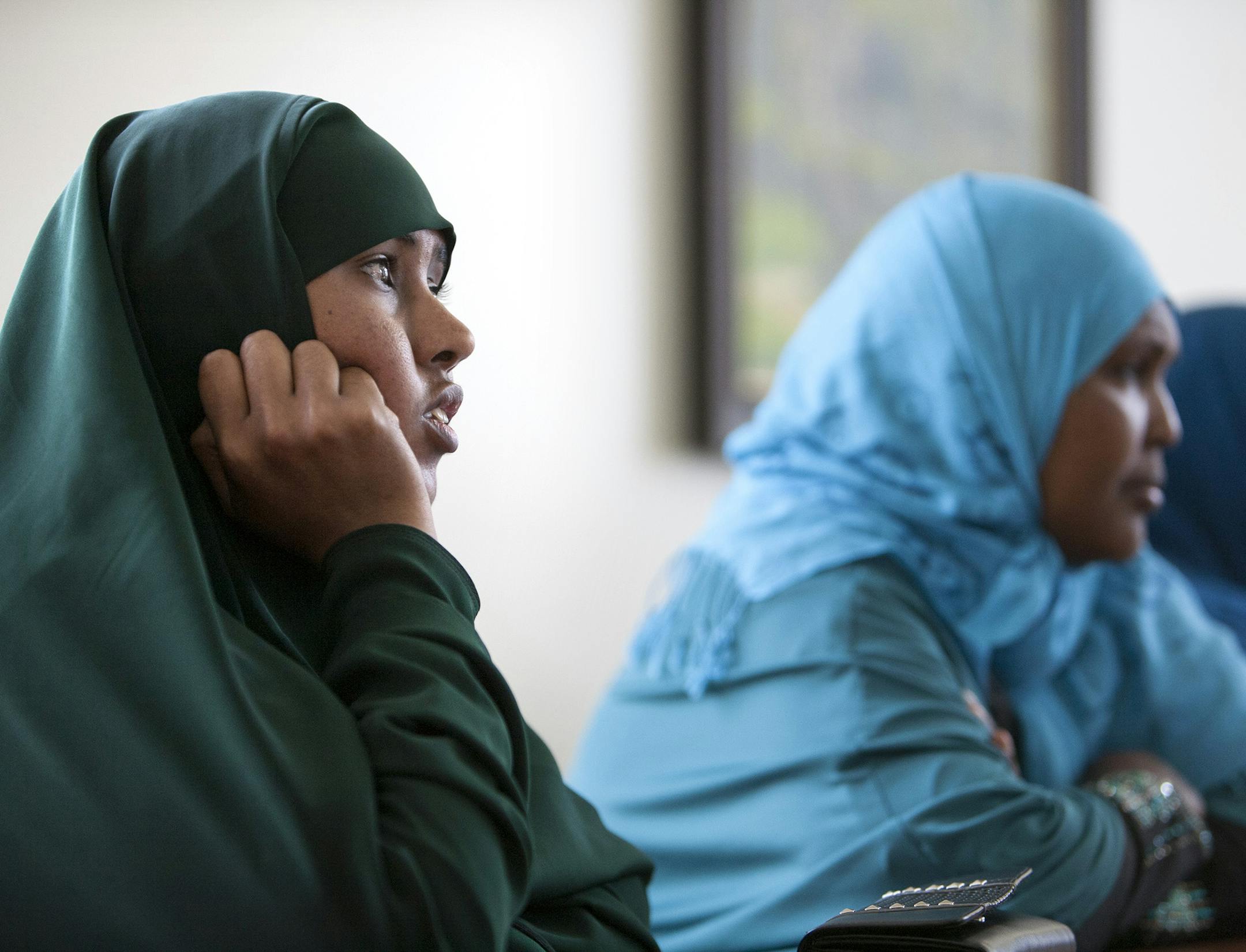 Hodan Dahir Ali, left, listens to instructors during a Cultural Orientation class at Lutheran Social Service of Minnesota in Minneapolis July 17, 2014. (Courtney Perry/Special to the Star Tribune)