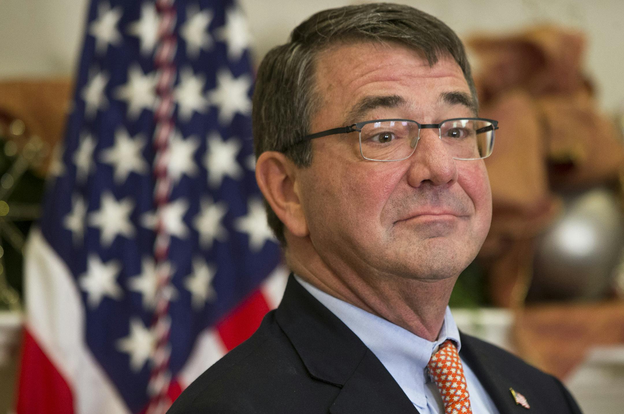 Ashton Carter listens as President Barack Obama announces Carter as his nominee for defense secretary Friday, Dec. 5, 2014, in the Roosevelt Room of the White House in Washington. (AP Photo/Jacquelyn Martin) ORG XMIT: DCJM112