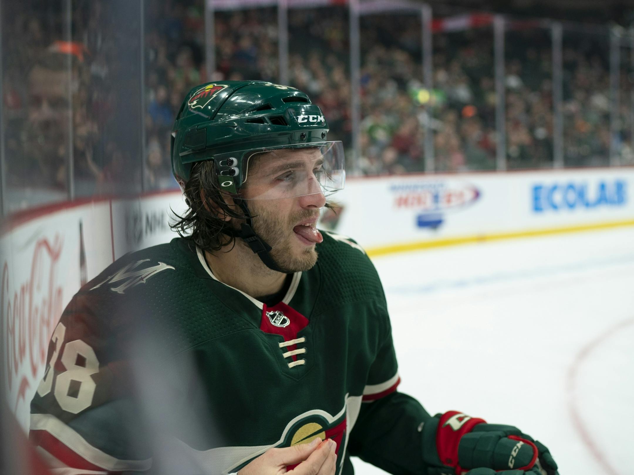 Minnesota Wild right wing Ryan Hartman (38) was bloodied in the mouth and possibly knocked a tooth out after he was hit with a high stick by Montreal Canadiens left wing Artturi Lehkonen (62) in the first period. Lehkonen was penalized for the hit and the Wild scored on the resulting power play.