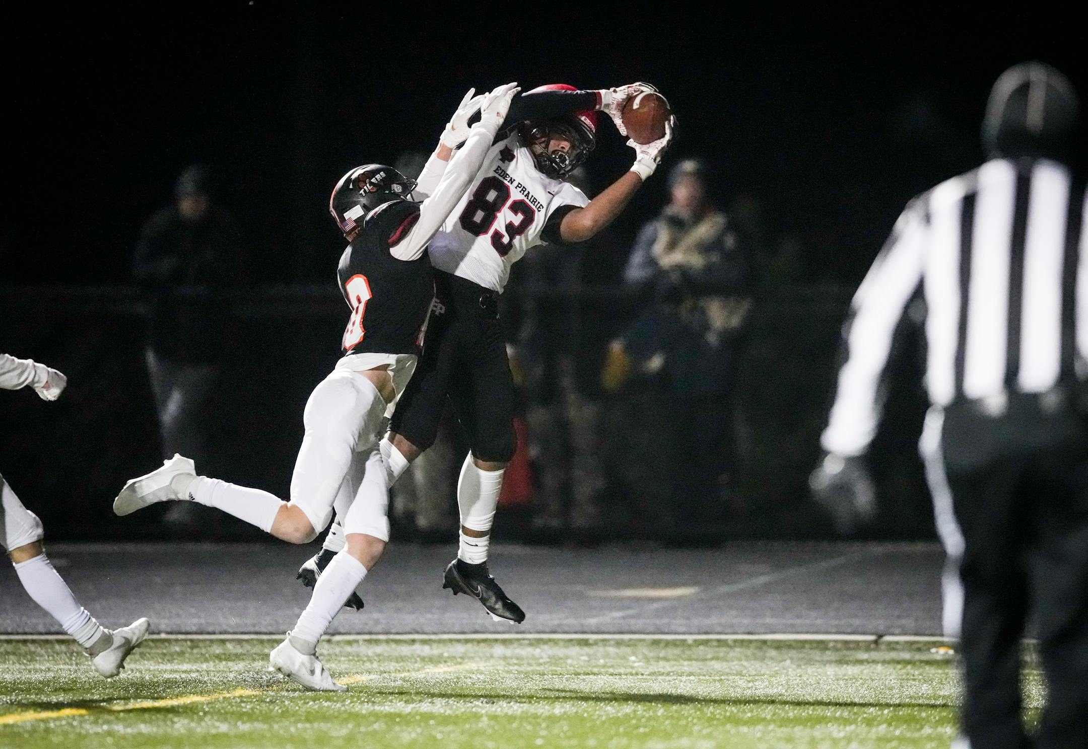 Eden Prairie wide receiver Michael Gross (82) catches a pass for a touchdown as Farmington defensive back Dylan Olson (10) tried to stop him in the first period. Eden Prairie High School played Farmington High School in the Class 6A football state tournament quarterfinal on Nov. 12, 2021, in Chanhassen, Minn. ] RENEE JONES SCHNEIDER • renee.jones@startribune.com