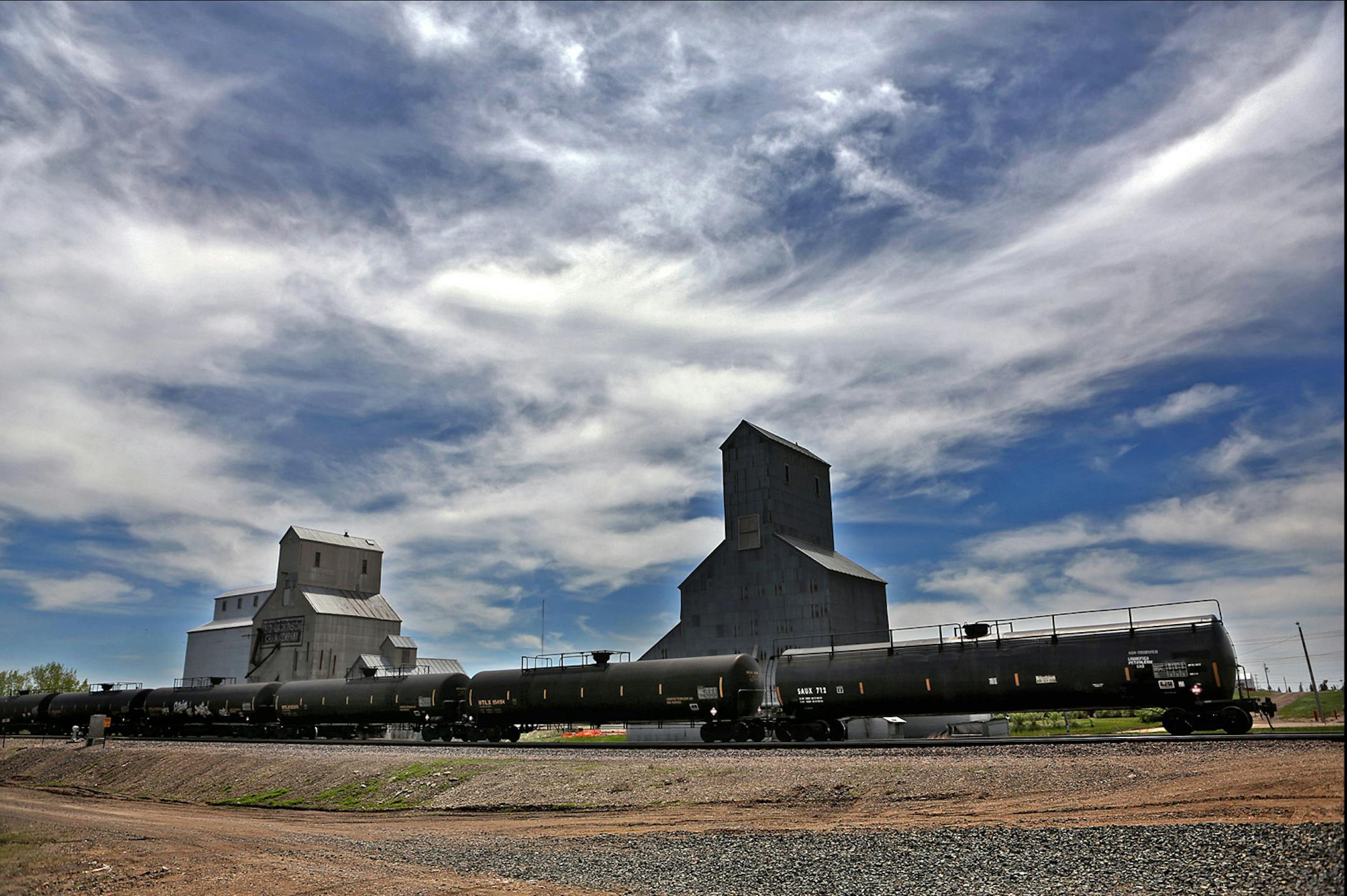 Oil tank cars were attached to a train in Tioga, the small town where oil was previously discovered nearby in the 1950‚ in the Williston Basin. Oil production in North Dakota is coming close to 1 million barrels a day, with much of it being transported by rail.