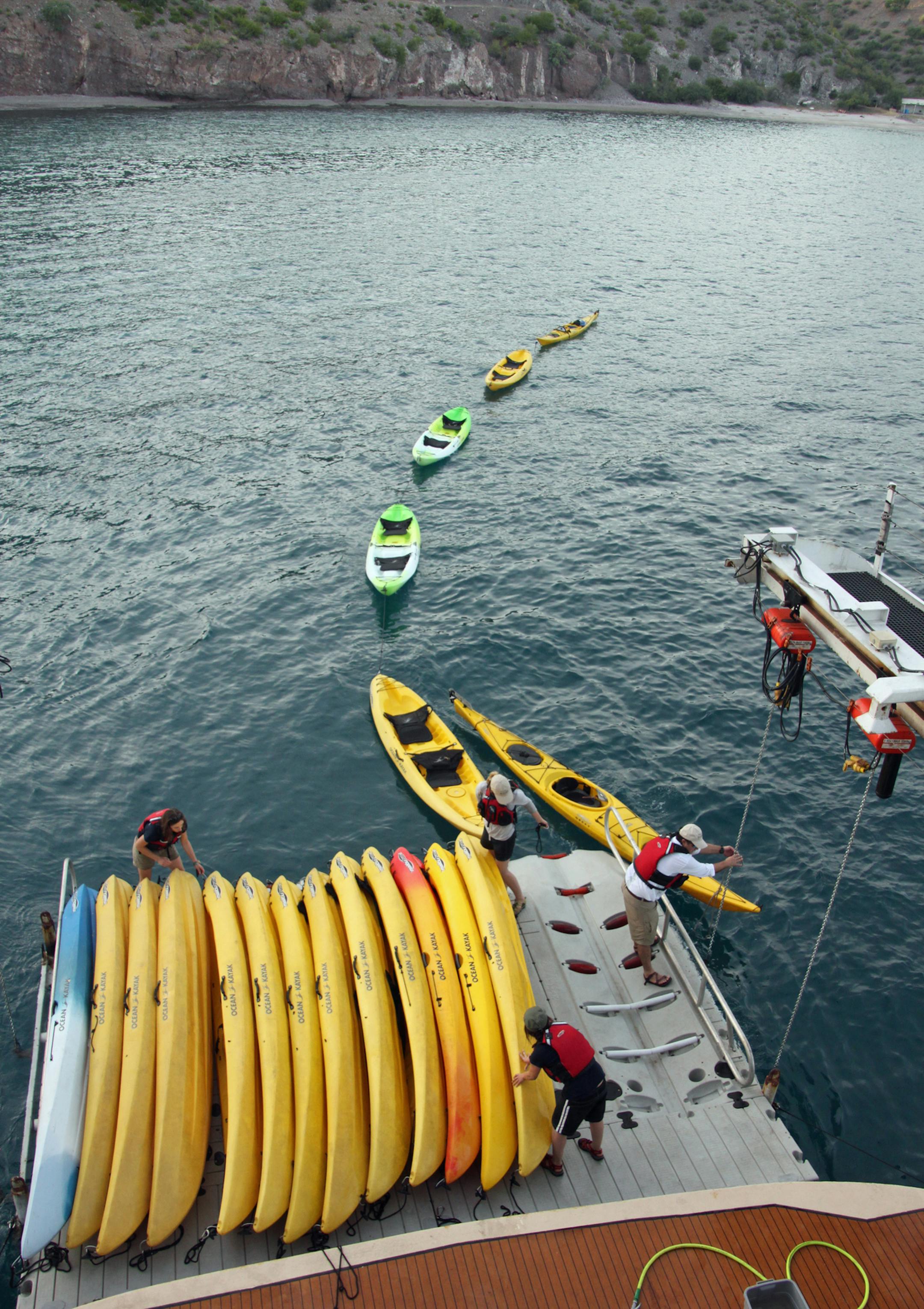 The crew unloads kayaks in preparation for a day of exploring one of the uninhabited islands in the Sea of Cortez. Photo provided by Donnelle Oxley